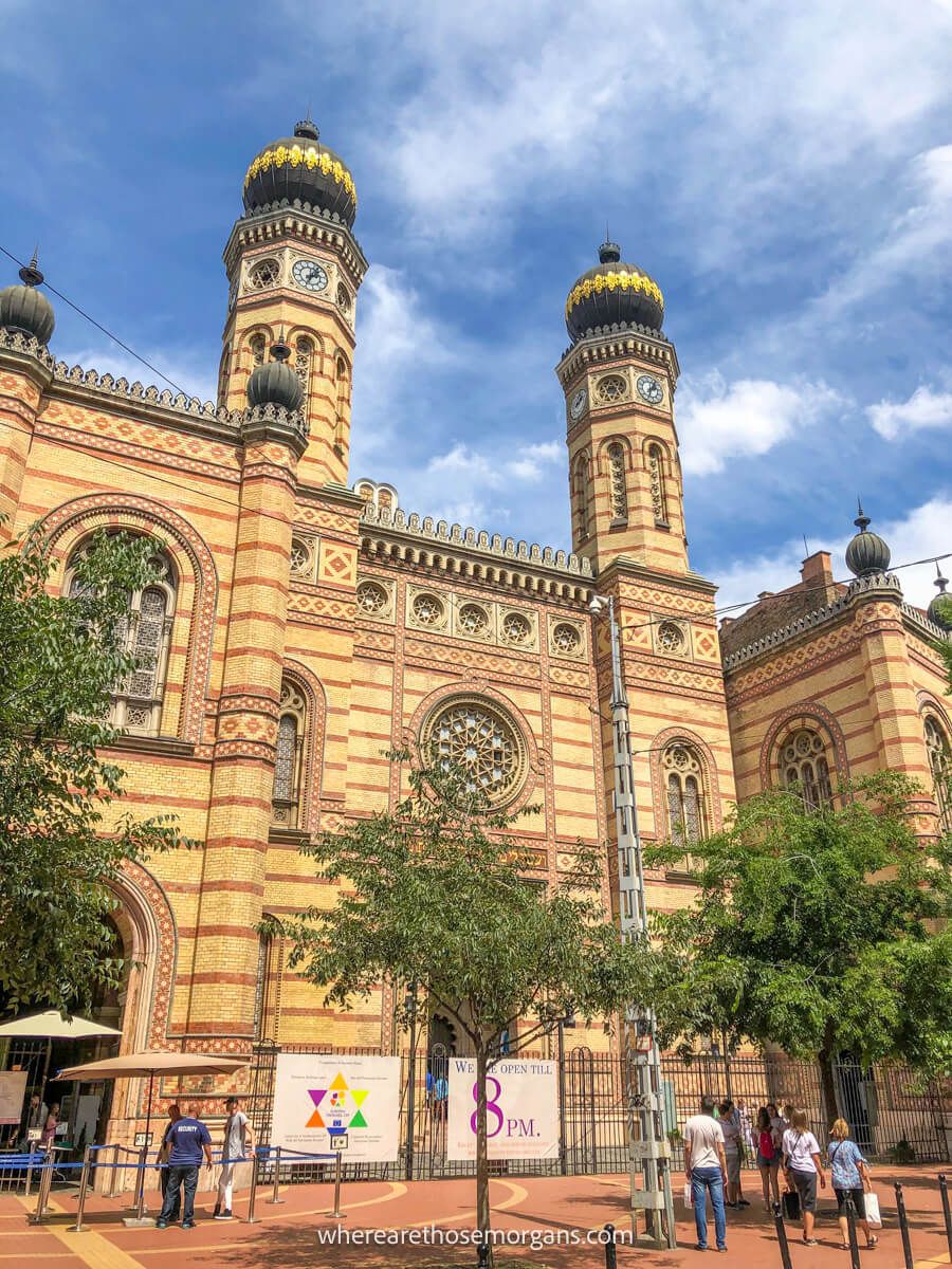 Photo of the outside of a large synagogue on a sunny day in Hungary