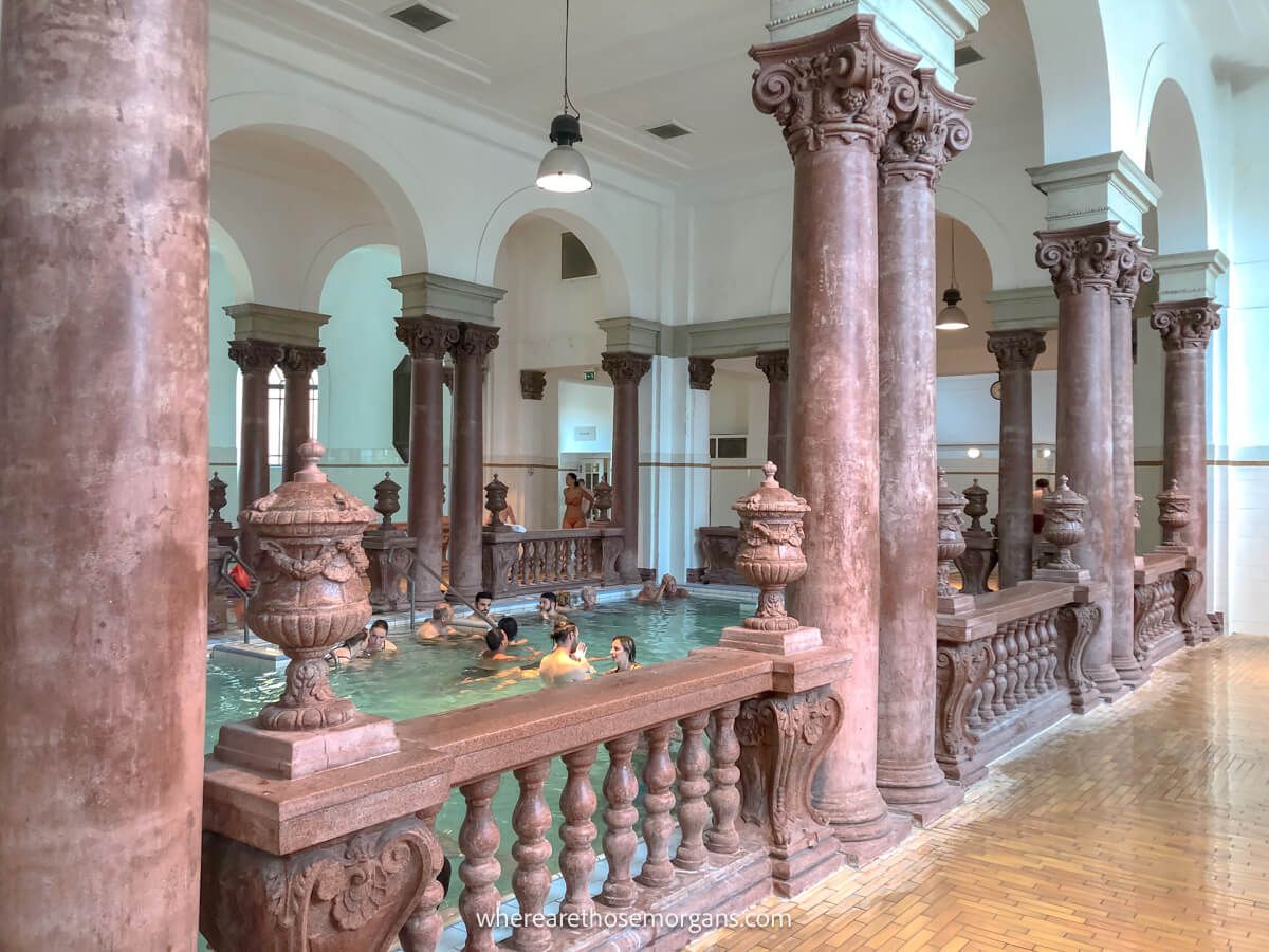 Photo of an indoor bathing pool with brown columns surrounding