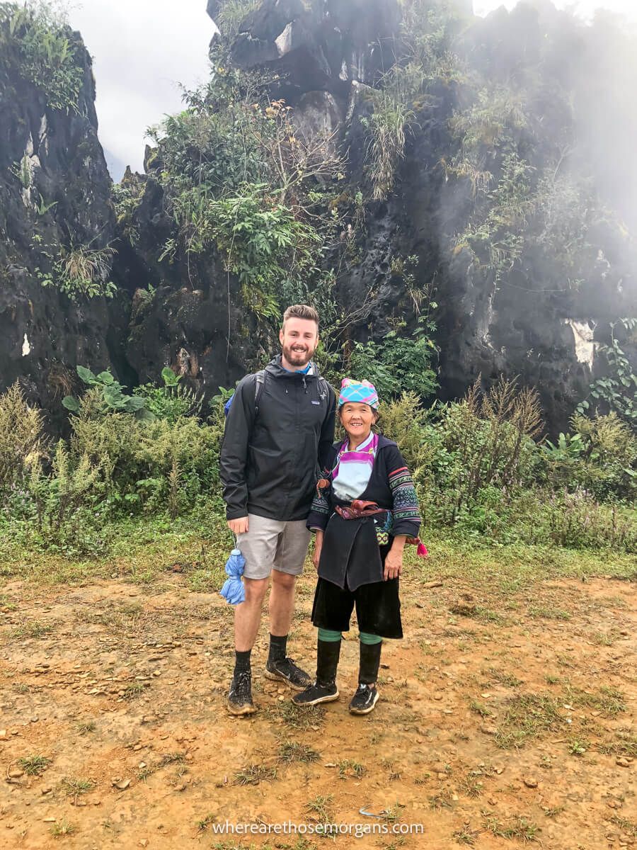 Man posing with a member of the Hmong community during a hike