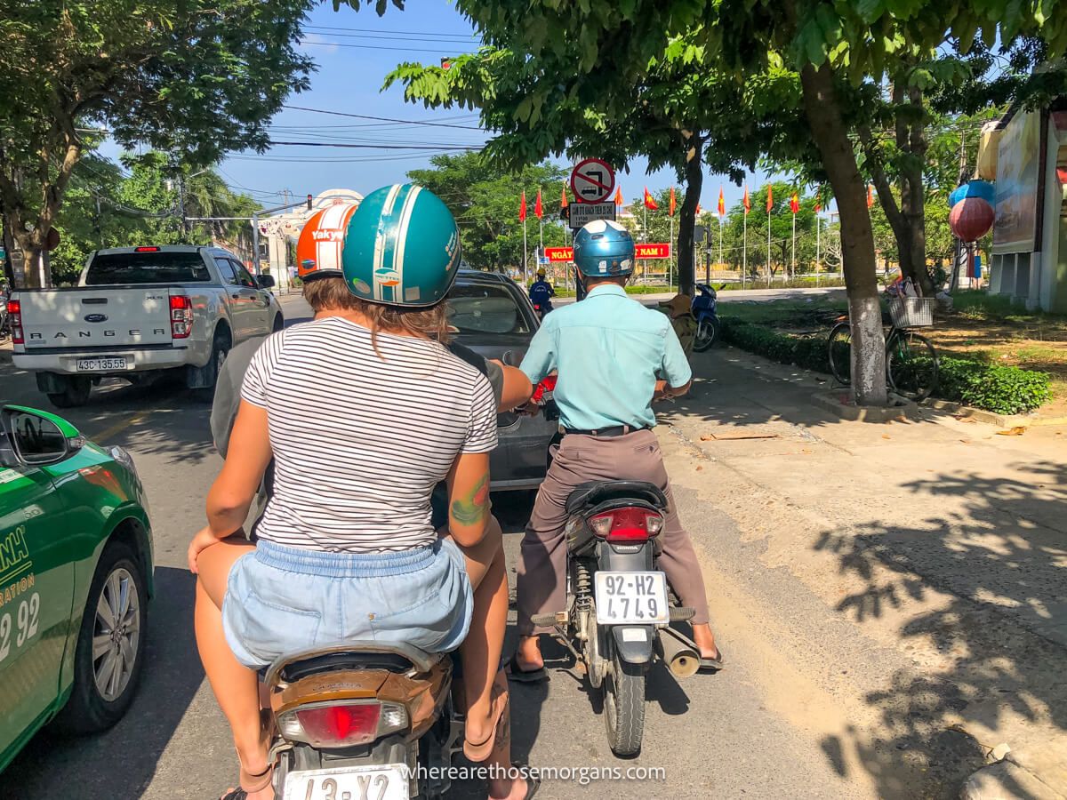 Two motorbikes in traffic in Hoi An
