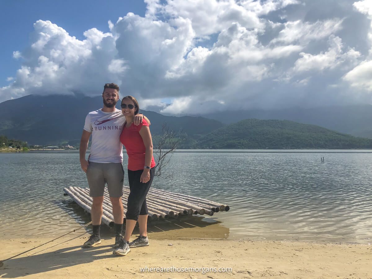 Man and woman posing for a photo along a beach in Vietnam