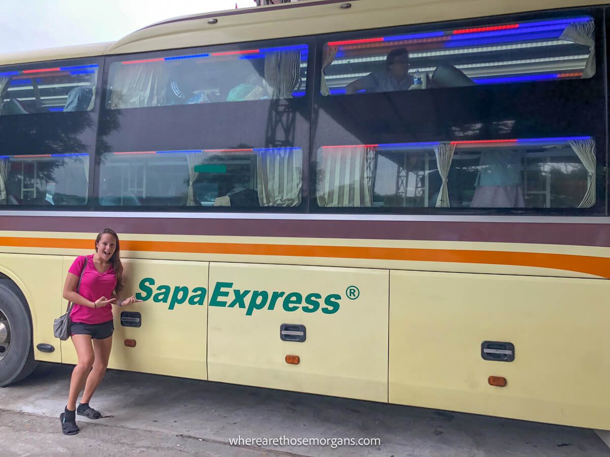 Woman taking a photo outside the Sapa express bus