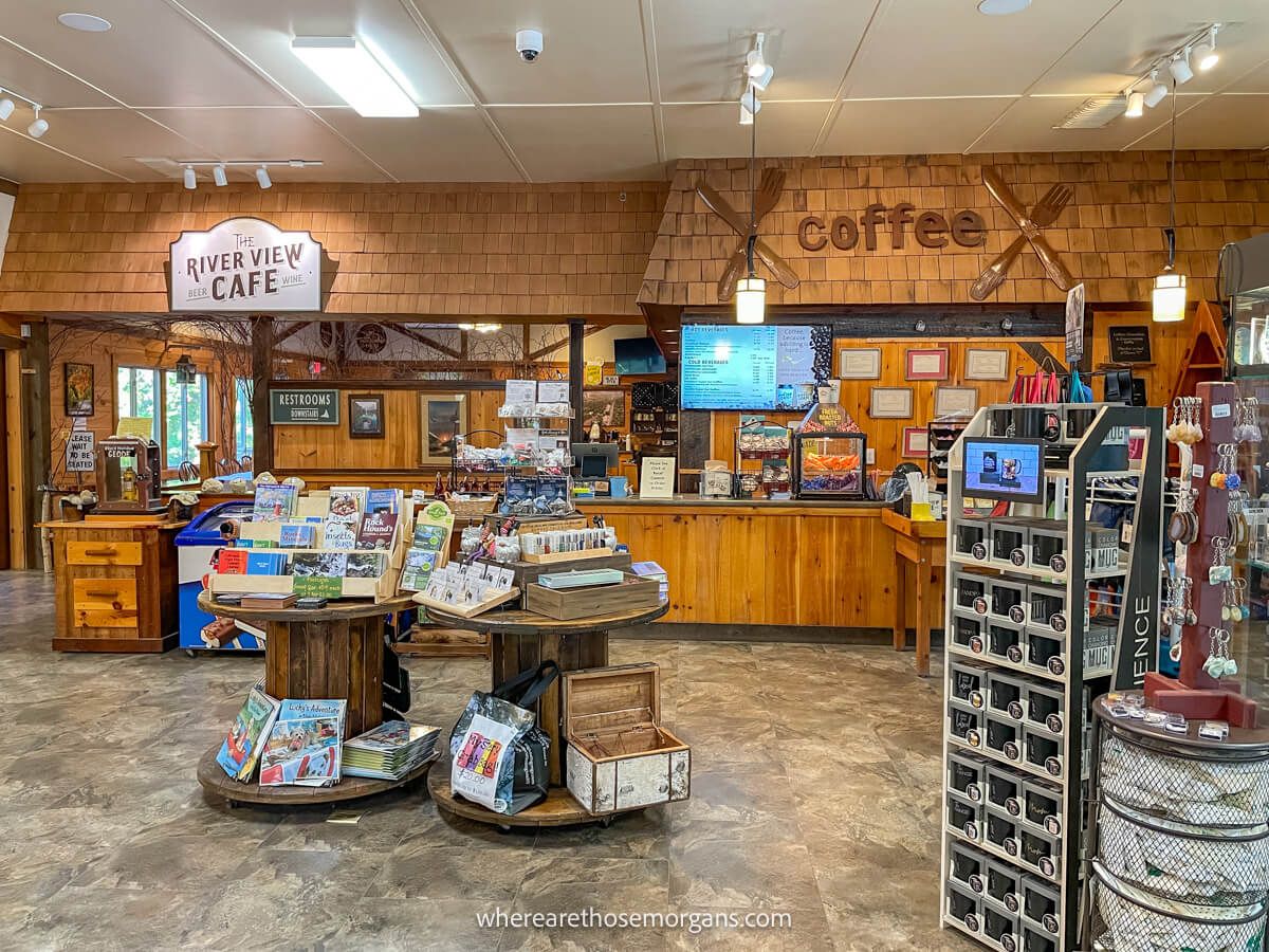 Photo of a coffee shop and gift store with wooden walls and tiled floor