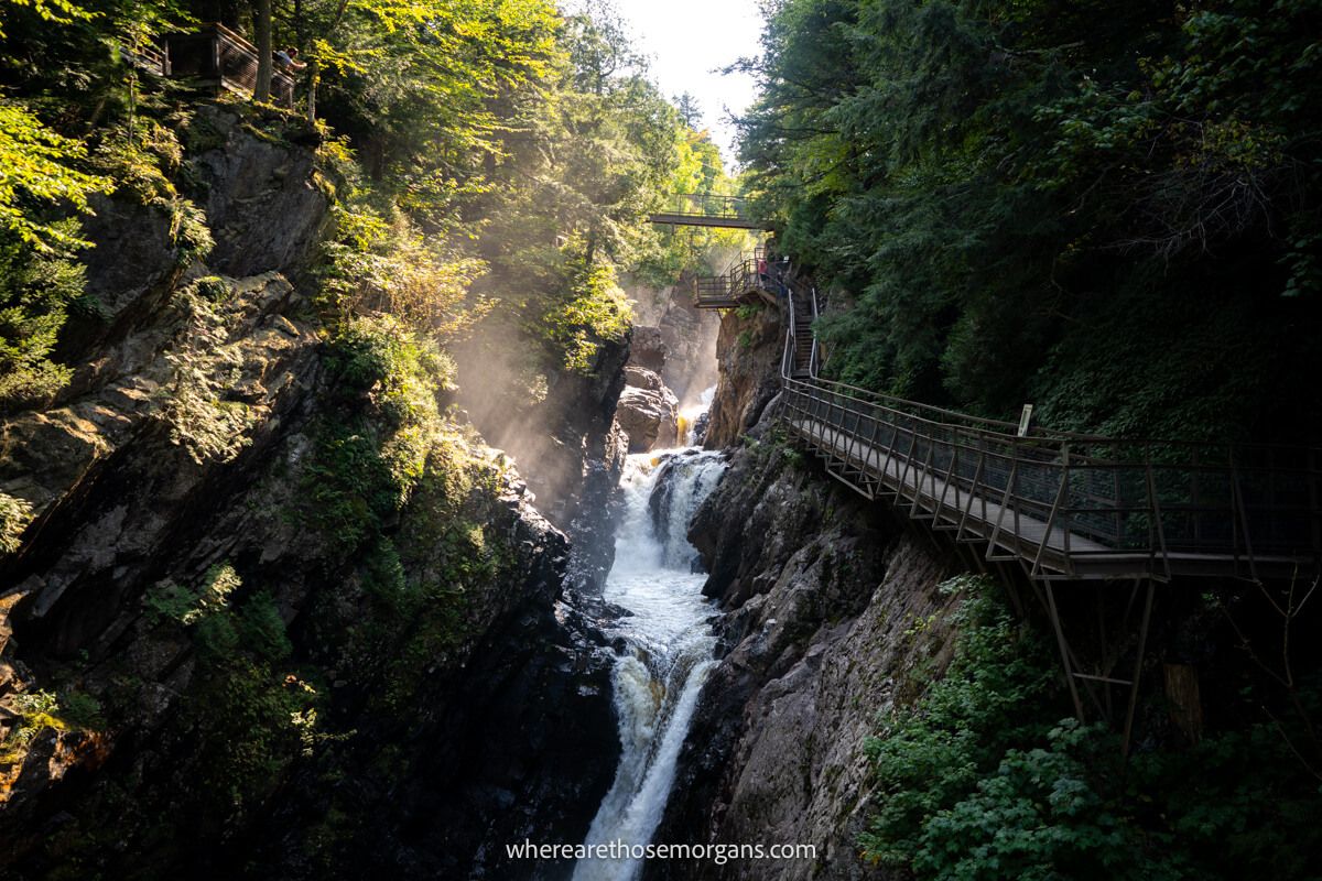 Photo of High Falls Gorge near Lake Placid NY with heavy contrasts between shadows inside the gorge and sun beams bursting in from one side