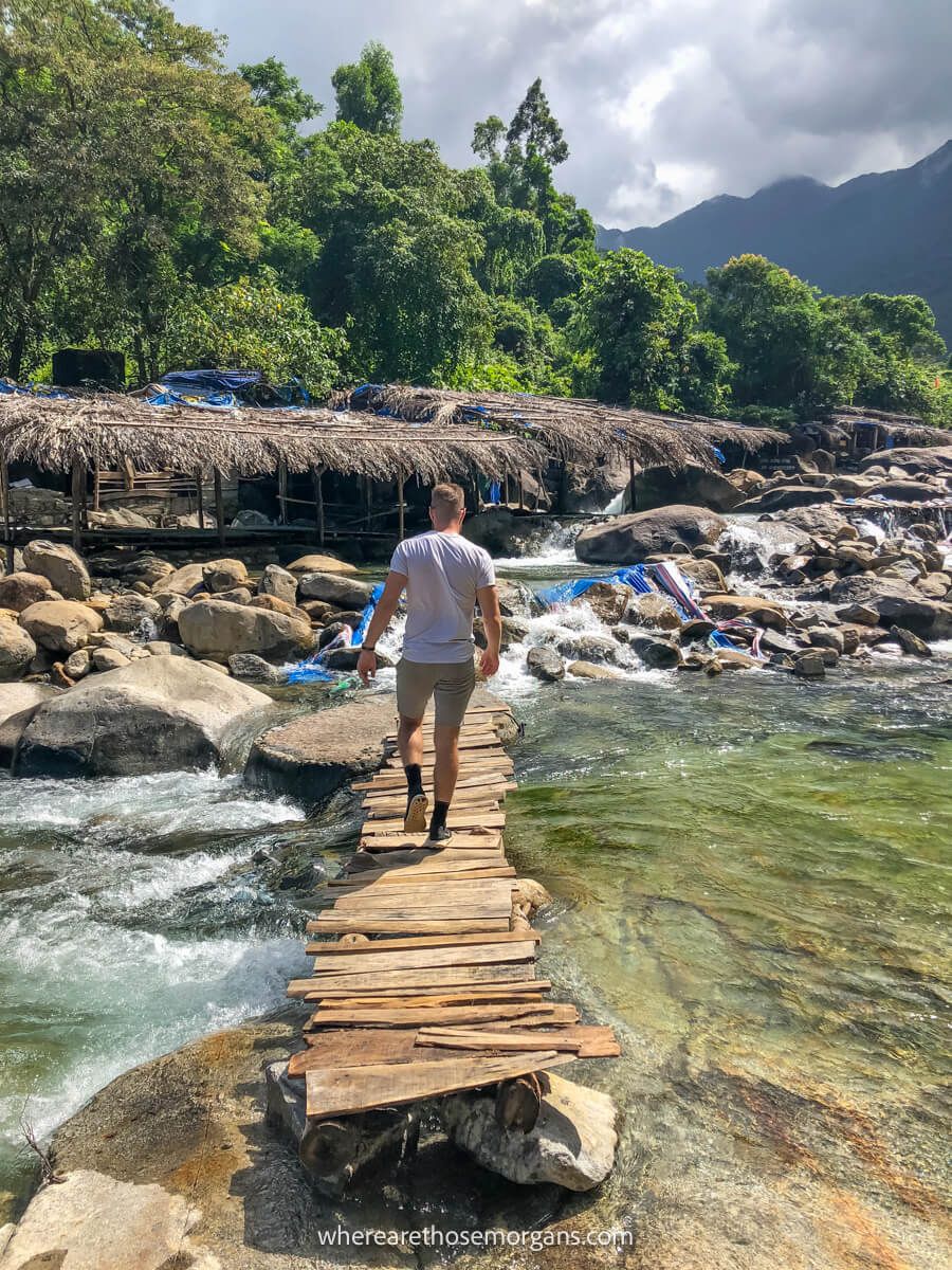 Person walking down a wooden boardwalk at Elephant Springs