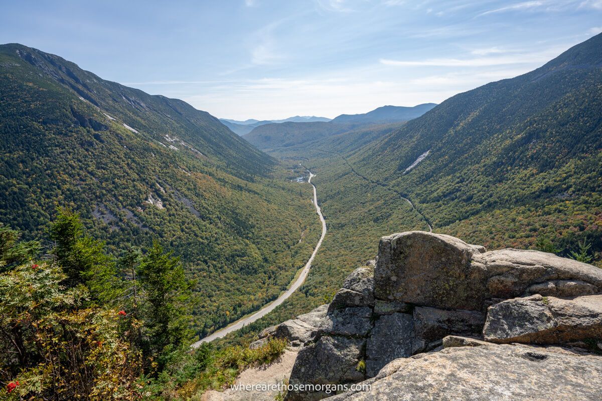 Long stretch of road in New England during the fall season