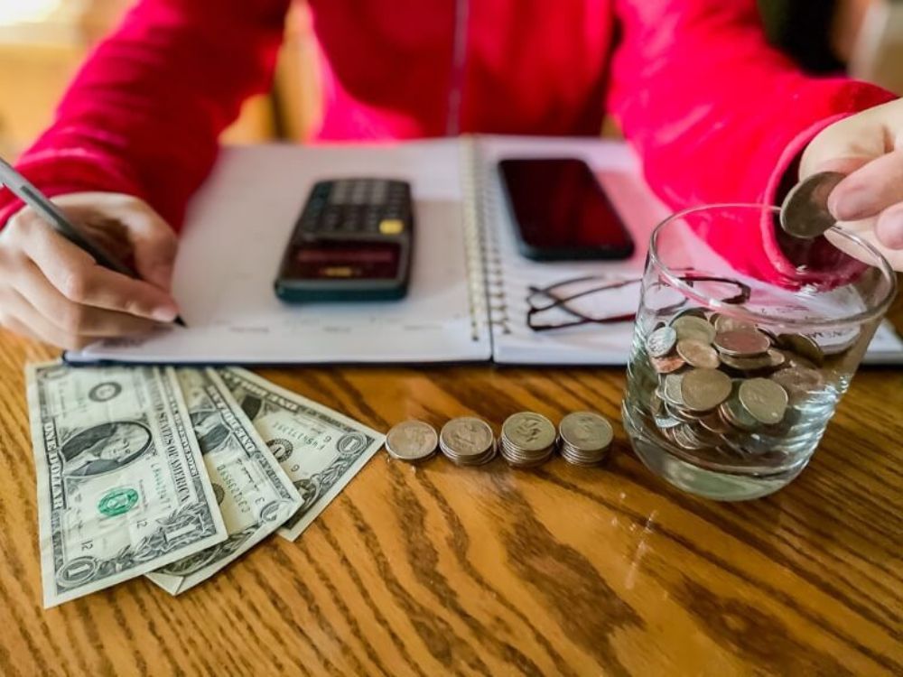 Person creating a budget for a trip