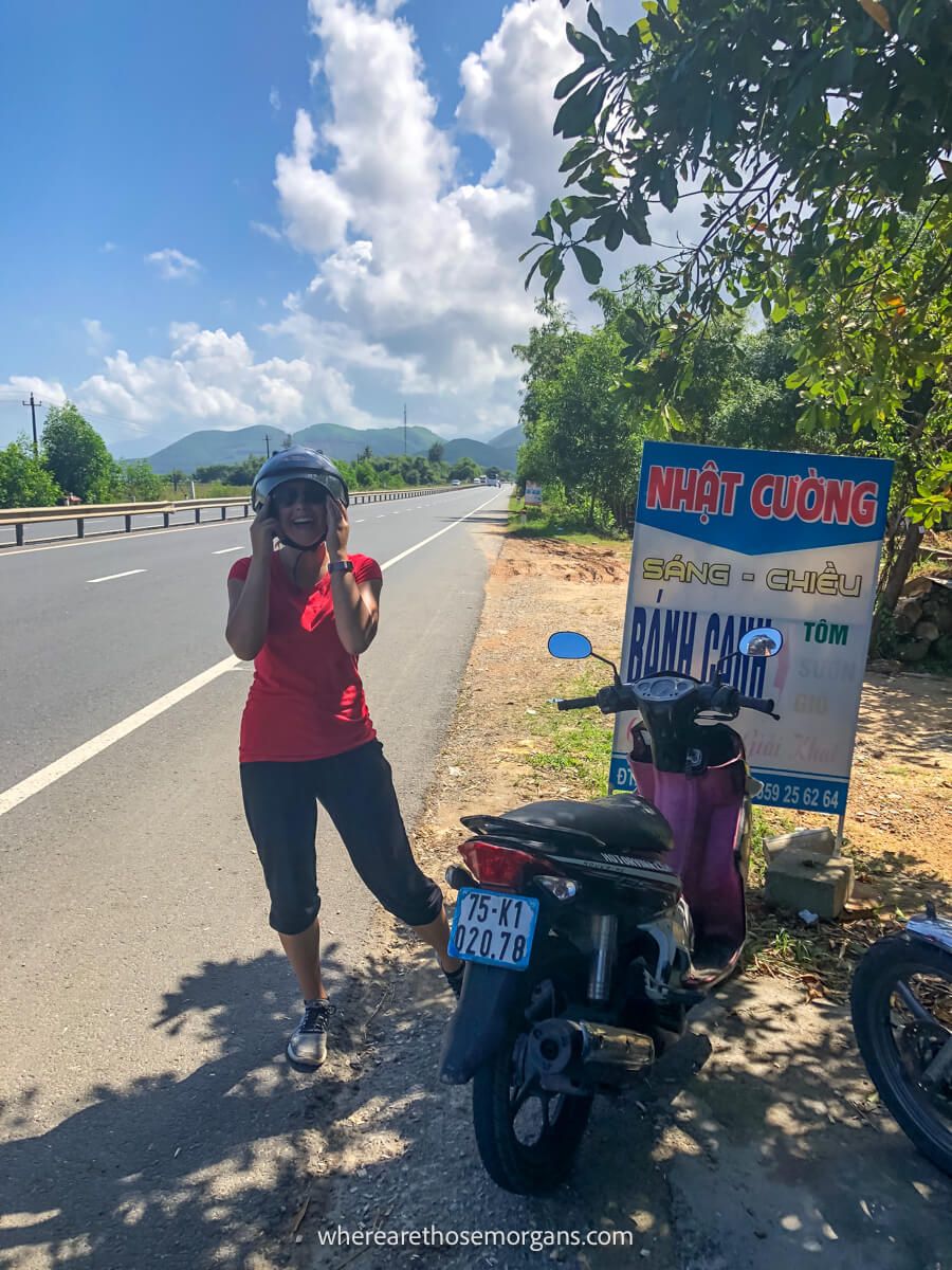 Woman excited to drive the Hai Van Pass in Vietnam