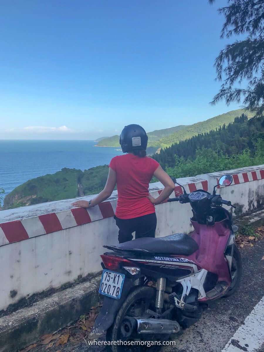 Woman looking out over the ocean along the Hai Van Pass in Vietnam