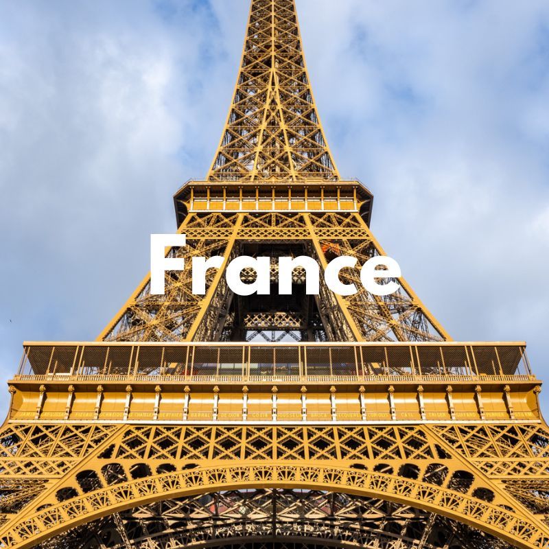 Photo of the Eiffel Tower from below looking up with the word France overlaid
