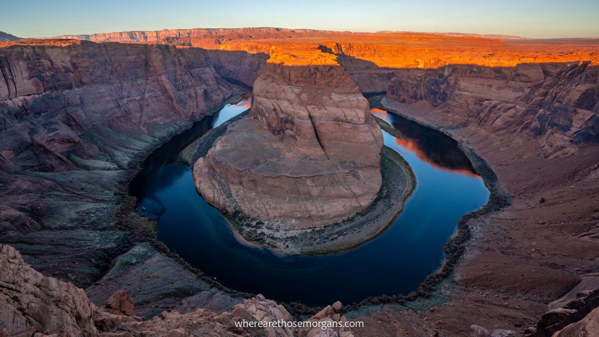 Huge U-shaped bend in a river canyon at sunrise
