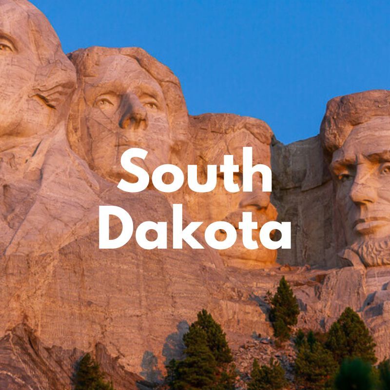 Photo of Mount Rushmore sculpture at sunrise with the words South Dakota overlaid
