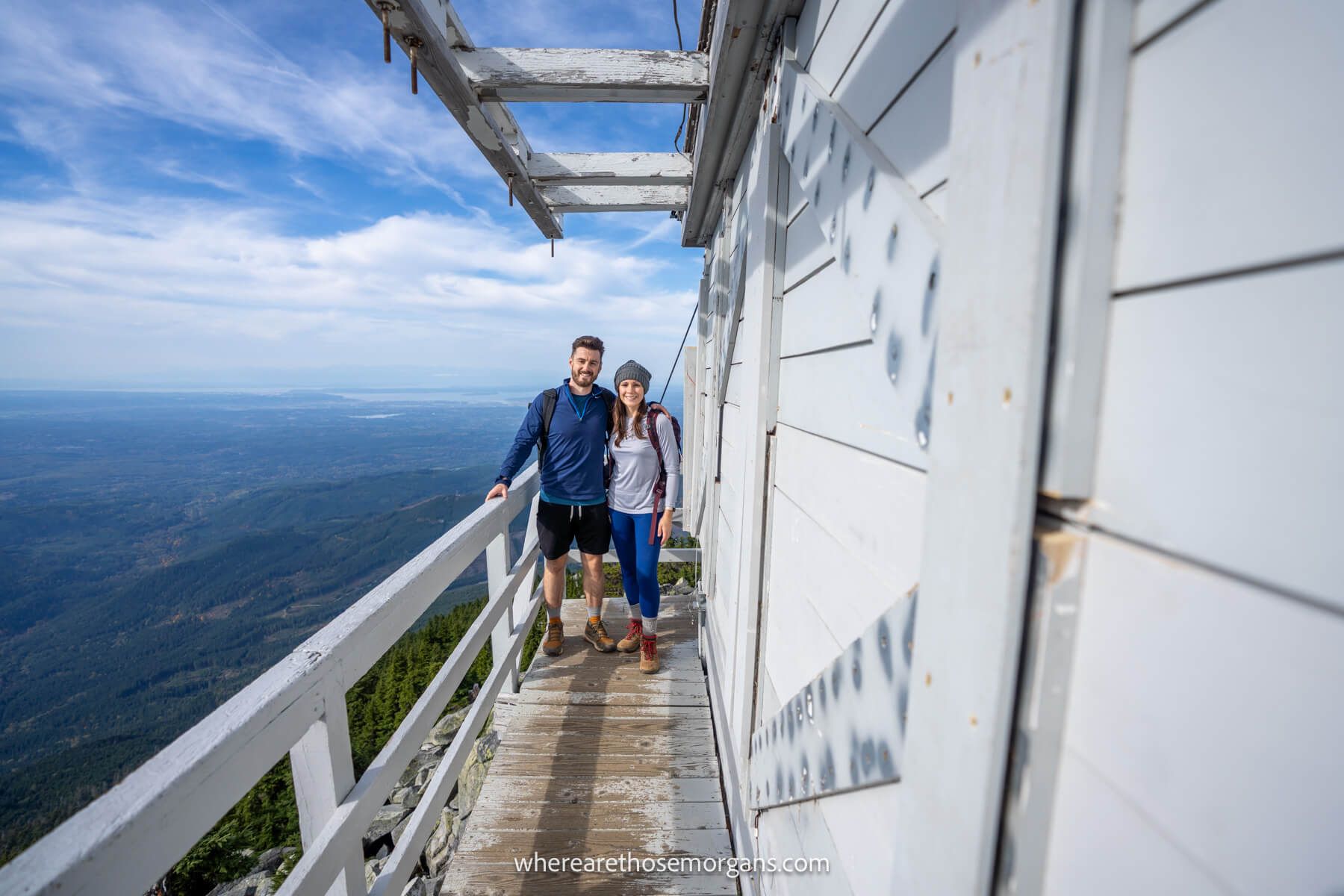 where are those morgans washington Photo of Mark and Kristen Morgan from Where Are Those Morgans standing together on a wooden fire tower at the summit of a mountain in Washington State with far reaching views to the side
