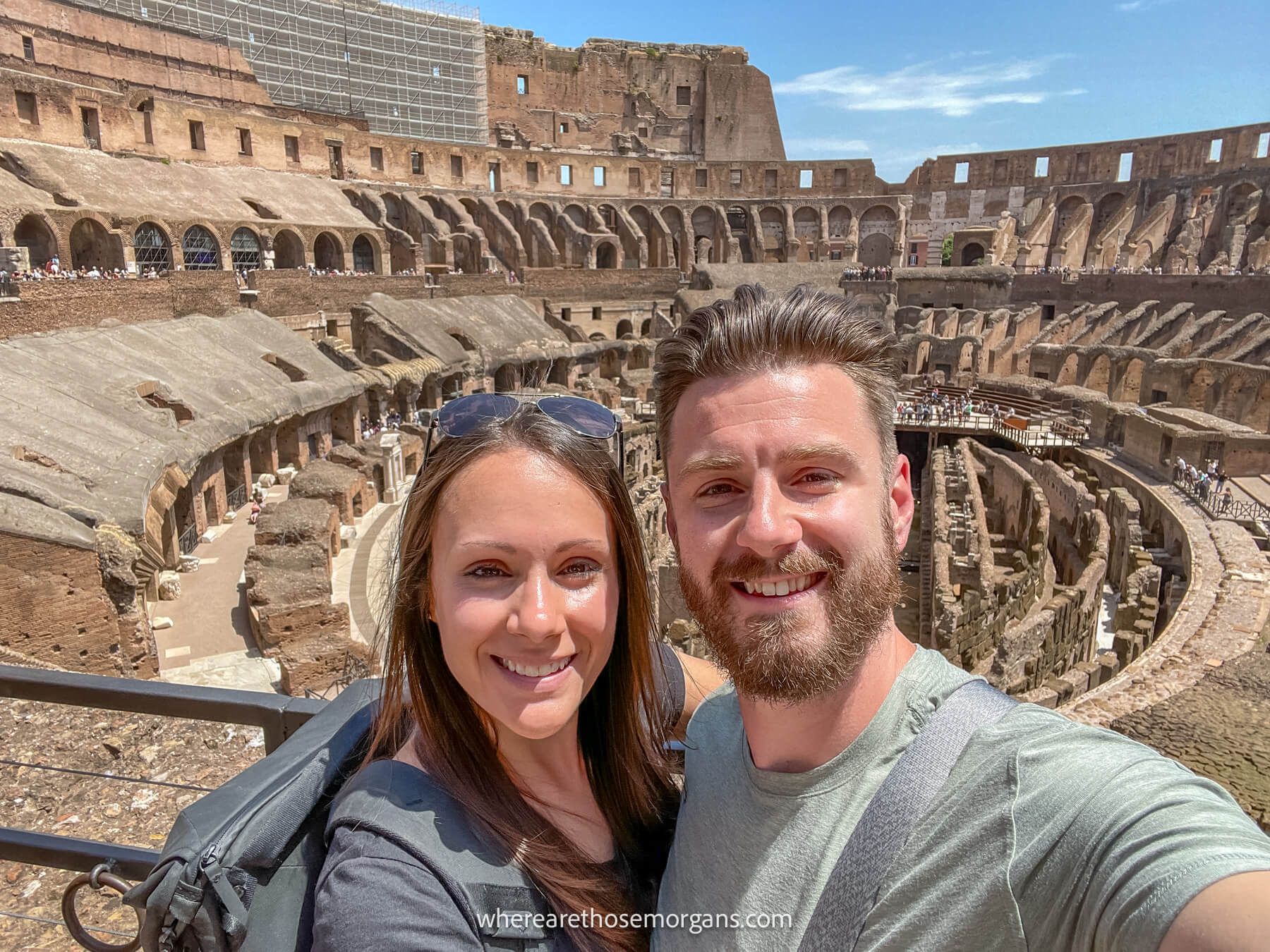 Photo of Mark and Kristen Morgan taking a selfie in the Colosseum of Rome on a sunny day