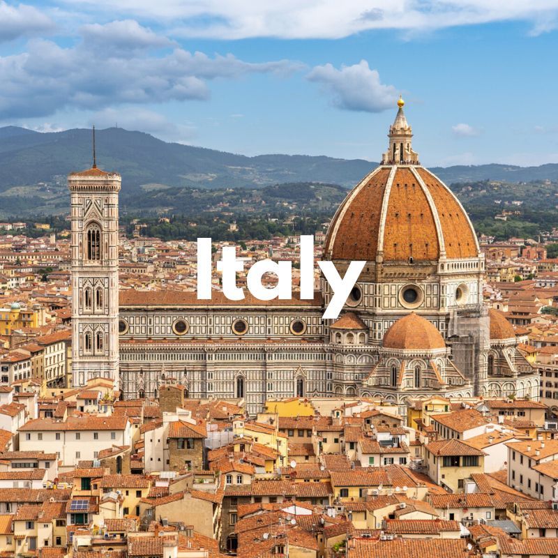 Photo of a city skyline in Italy with hundreds of buildings with red roofs and a huge church in the center bursting into the sky with the word Italy overlaid