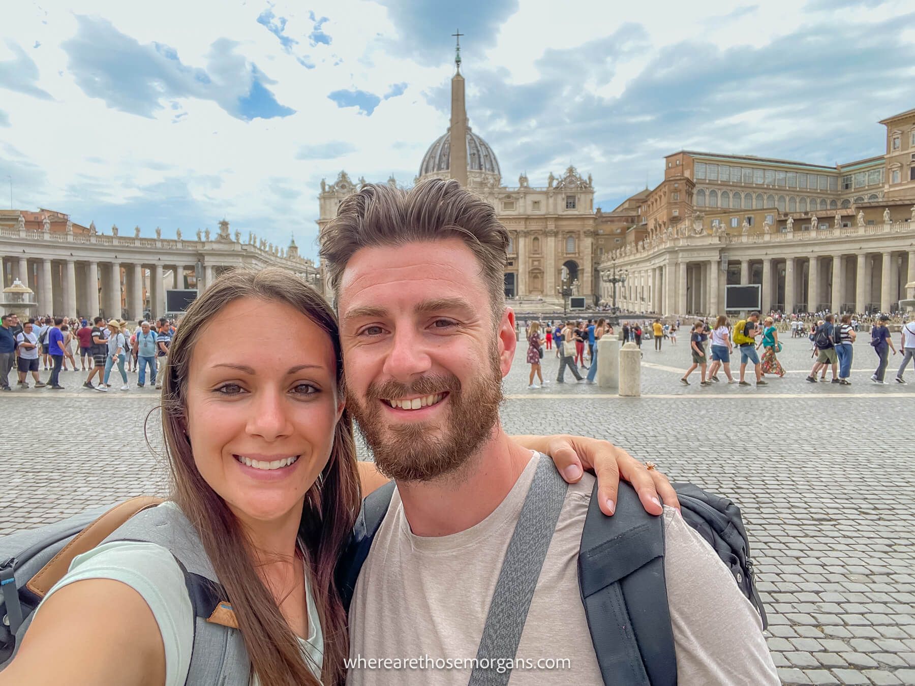 Photo of Mark and Kristen Morgan from Where Are Those Morgans taking a selfie in St Peter's Square after finishing a tour of the Vatican Museums