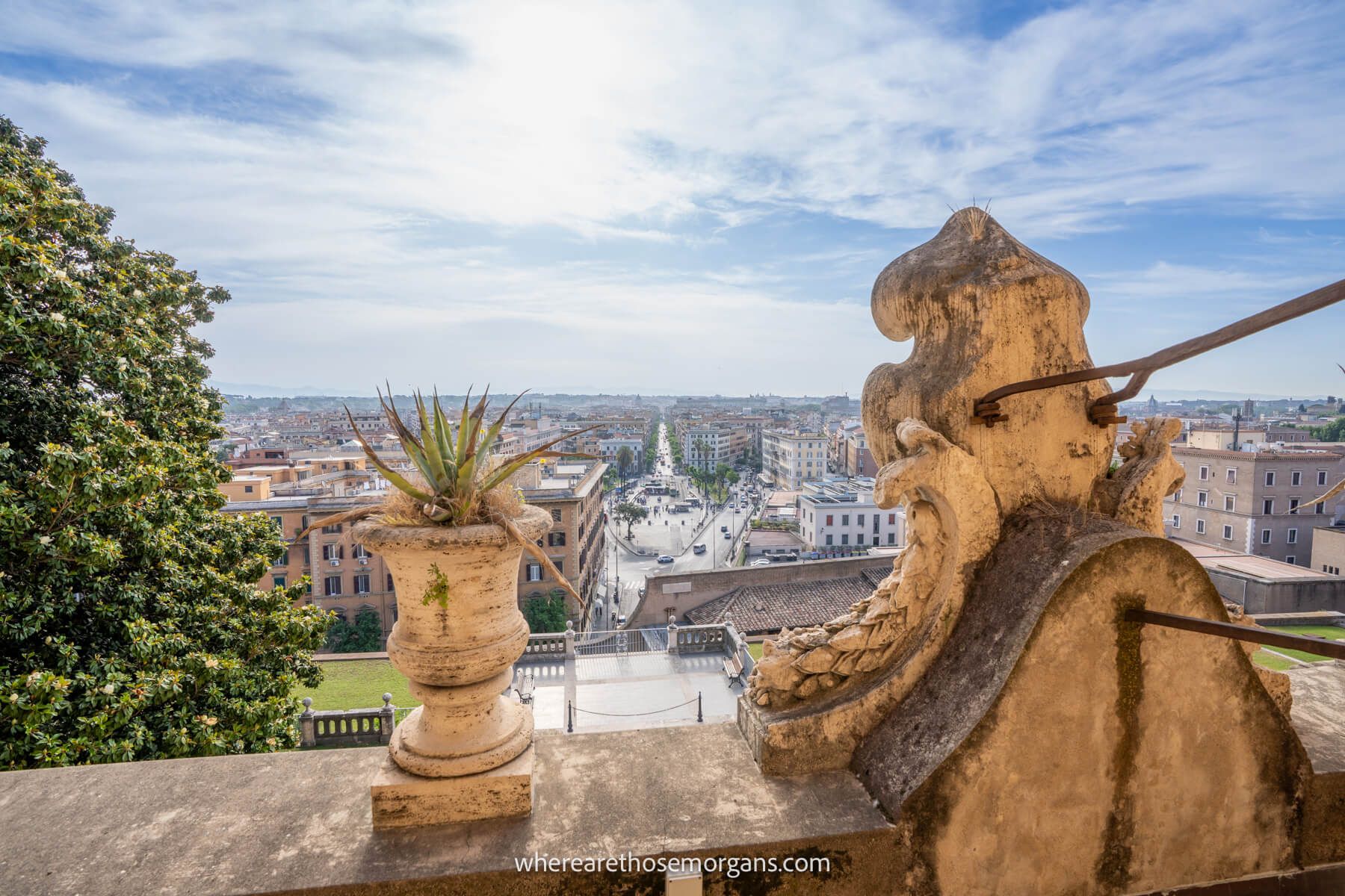 Photo of a stone balcony in the Vatican overlooking the neighborhood of Prati in Rome on a clear day