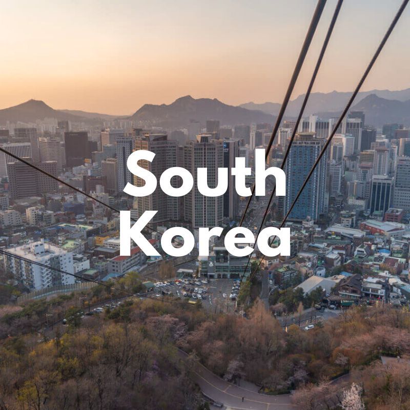 Photo of a city skyline at sunset from a cable car on a hillside and the words South Korea overlaid