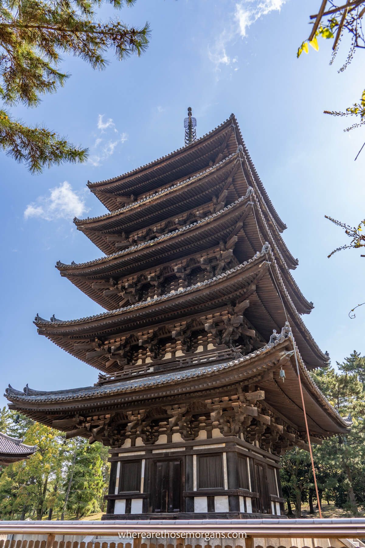 Photo of a five story pagoda at a temple site on a sunny day in Nara Japan
