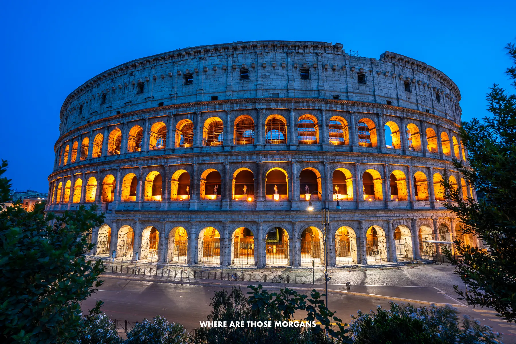 The Colosseum fully lit up at night from a close middle height vantage point