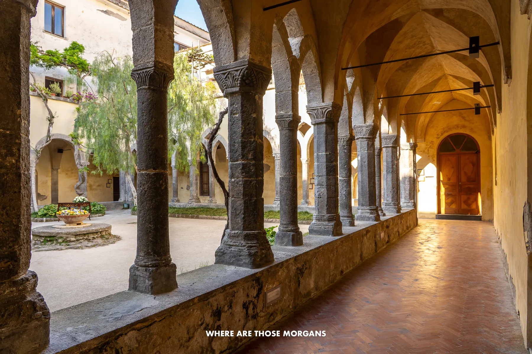 Photo of columns in a square shape around a courtyard in a monastery in Sorrento Italy