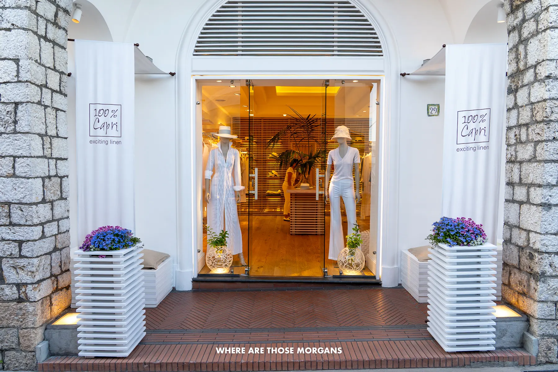 Photo of a white washed building entrance to a clothes store in Capri Italy