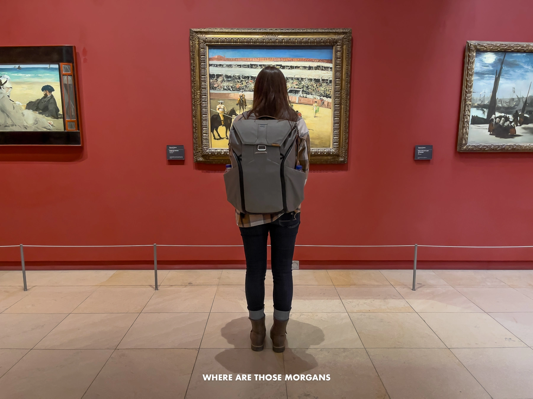 Photo of Kristen Morgan looking at paintings inside the Musee d'Orsay in Paris