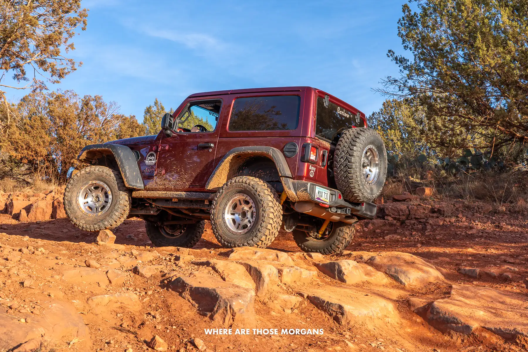 Photo of a jeep turning on deep rocks and dirt in Arizona