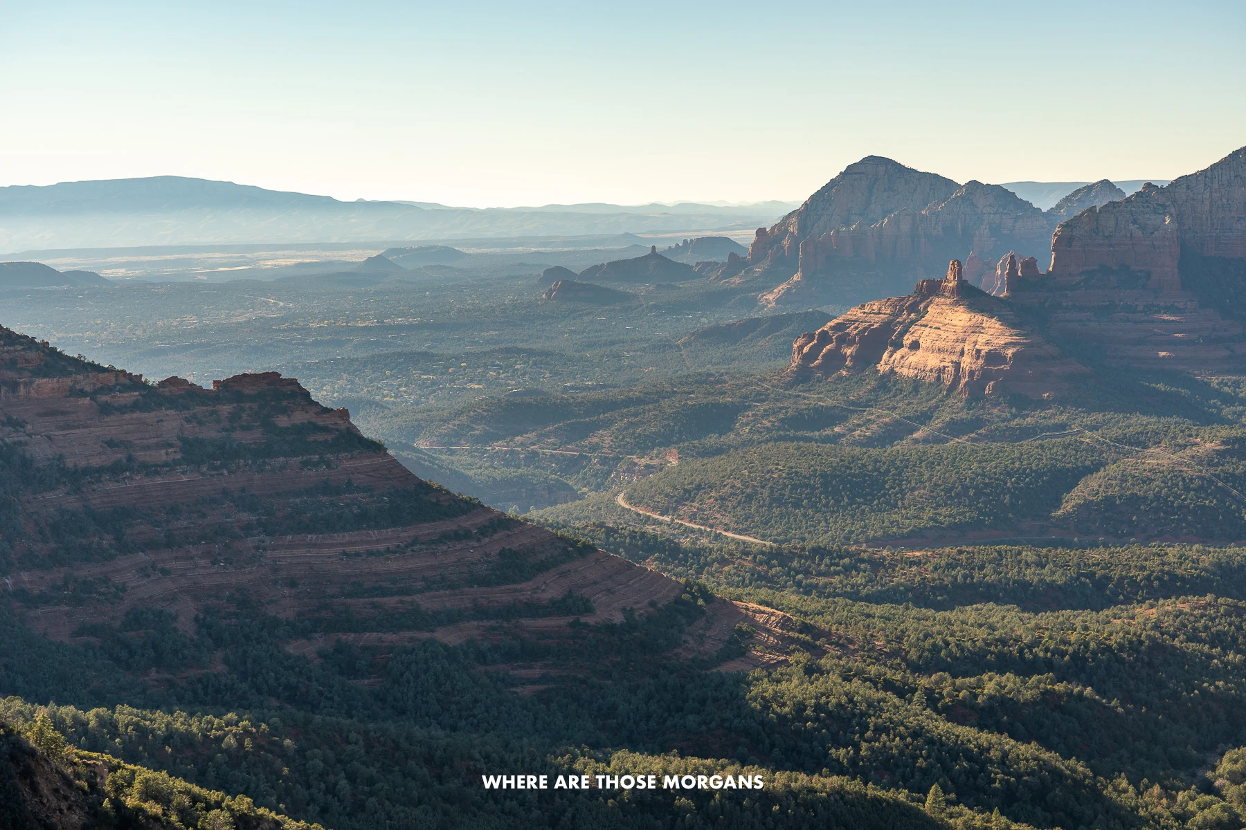 Photo overlooking Sedona from an elevated vantage point at the top of Schnebly Hill Road at dusk