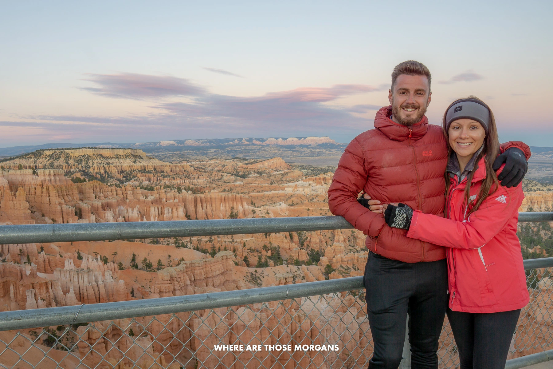 Photo of Mark and Kristen Morgan standing together in Bryce Canyon at sunset