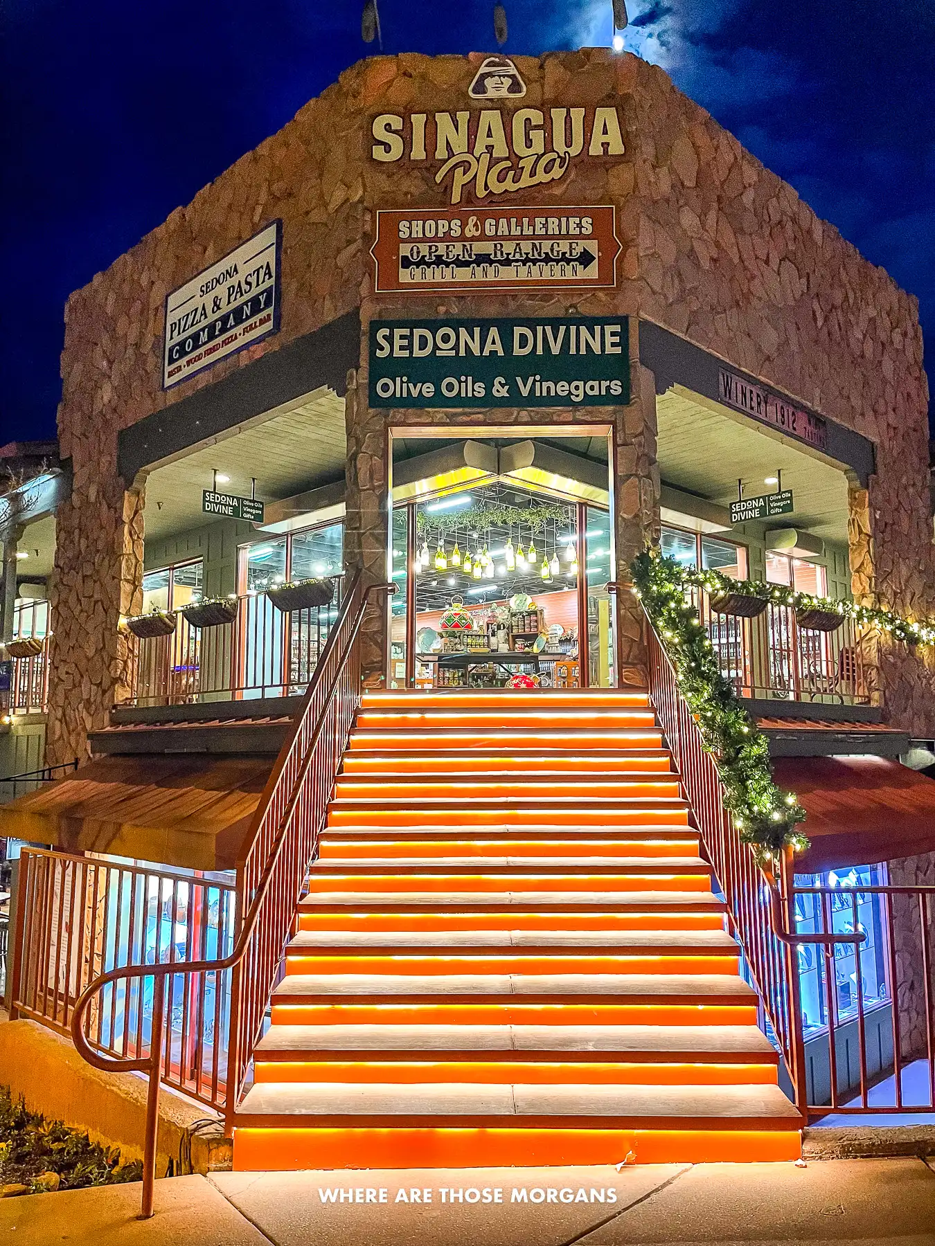 Photo of the entrance steps leading to a small strip mall in Sedona at night