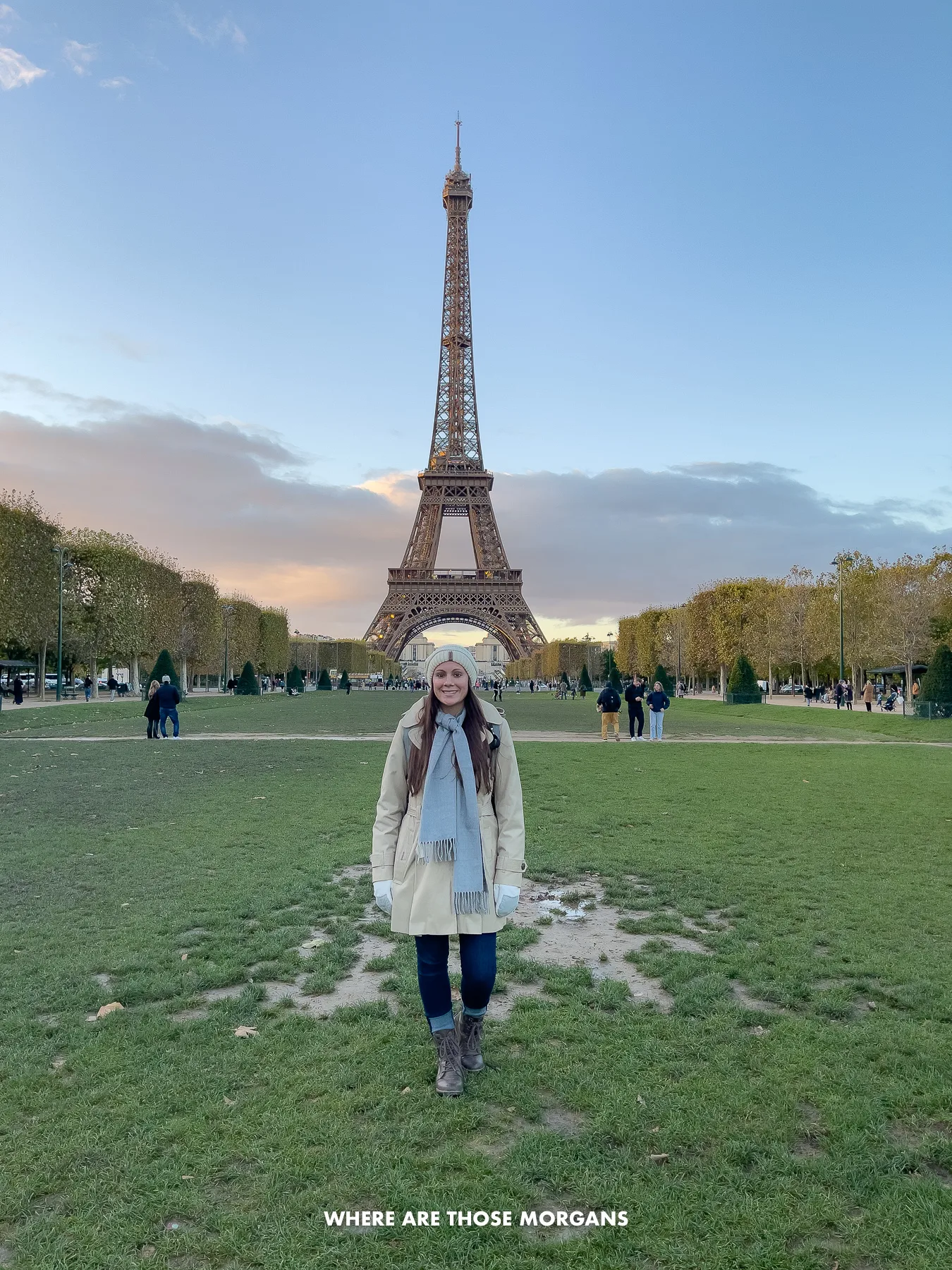 Kristen from Where Are Those Morgans standing on the green grassy Champ de Mars in Paris