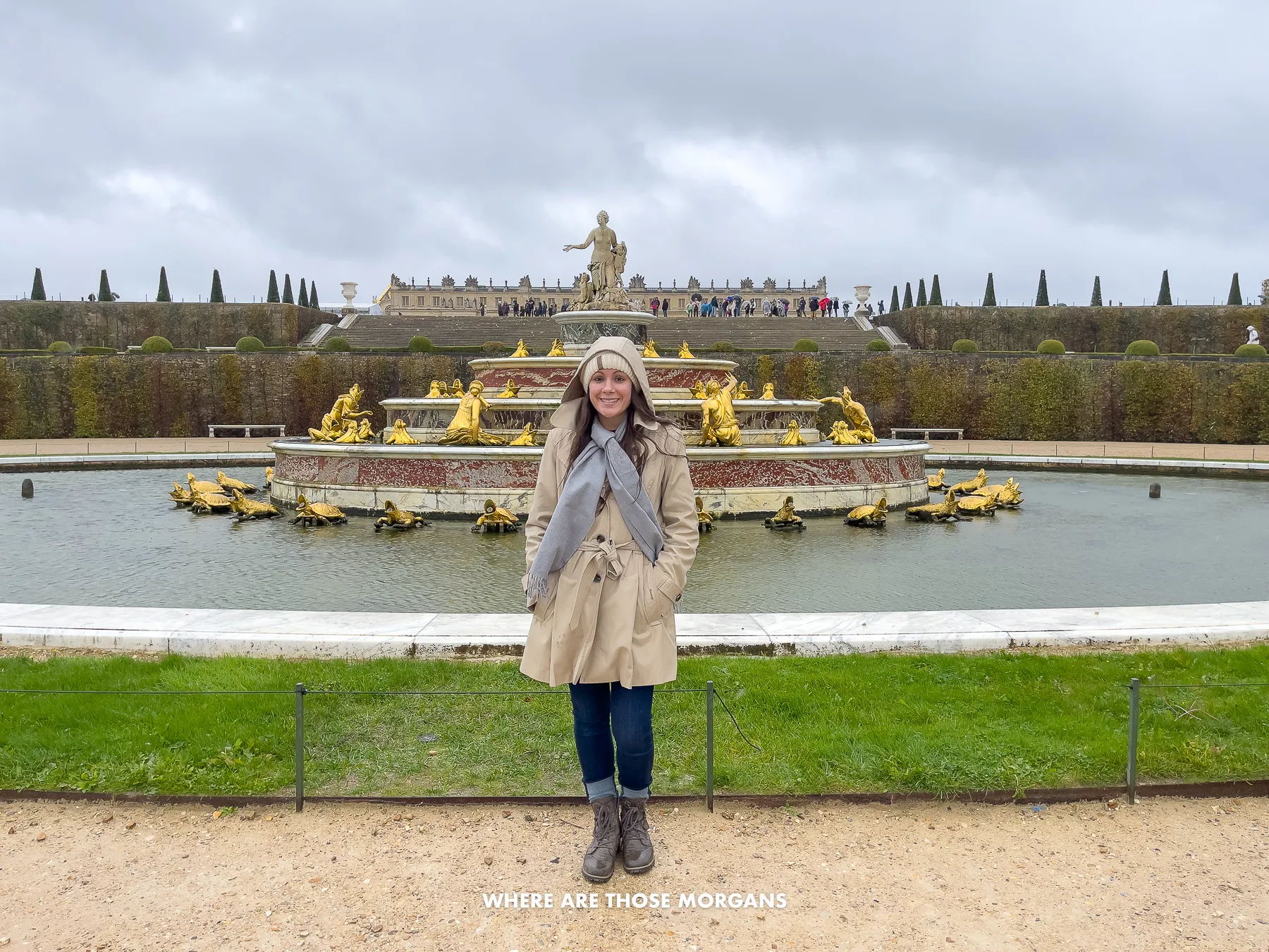 Kristen from Where Are Those Morgans standing in front of a fountain in the Palace of Versailles garden