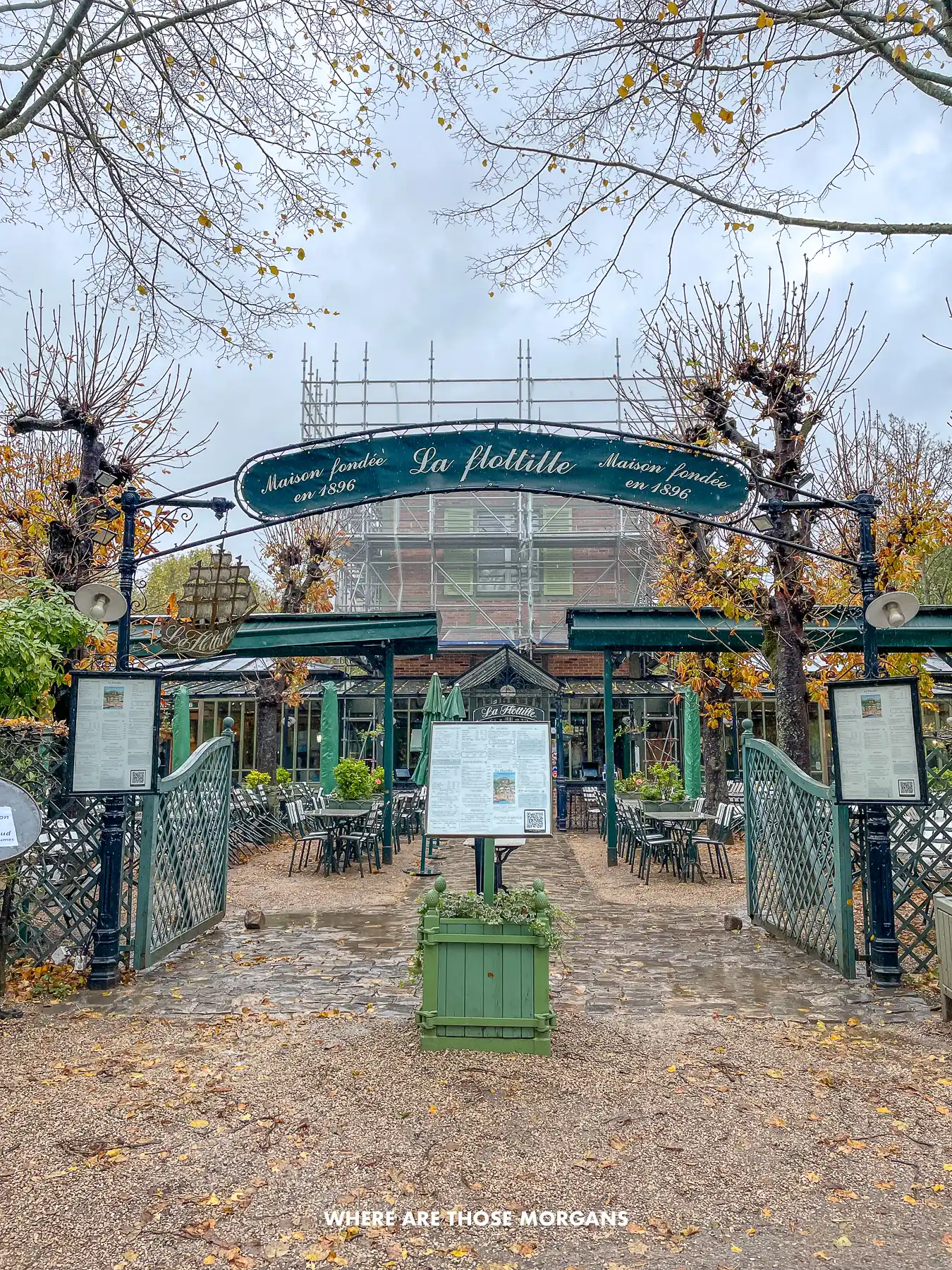 Entrance to La Flottille restaurant in the grounds of the Palace of Versailles on a cloudy and rainy day in Paris