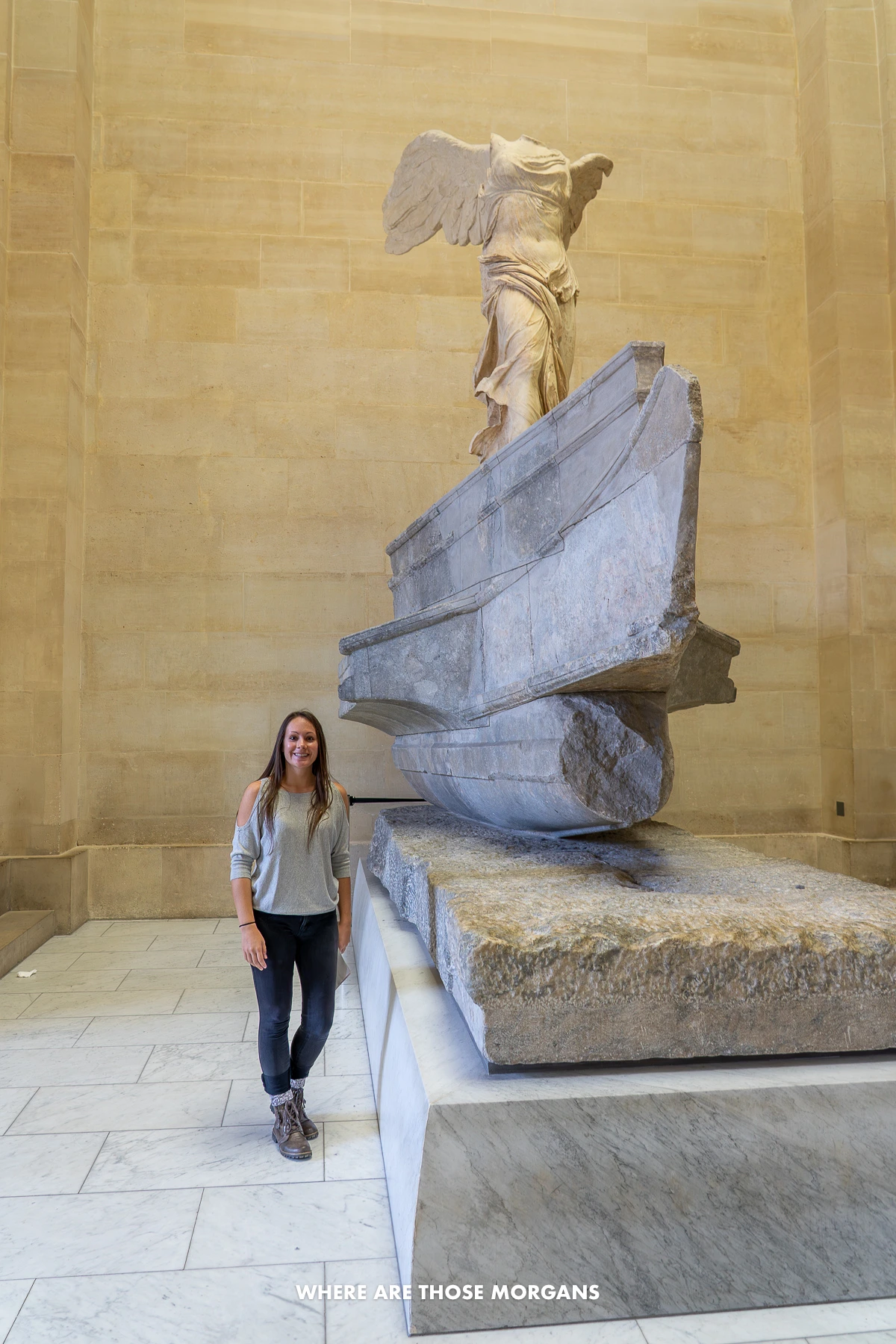 Photo of Kristen from Where Are Those Morgans standing next to the Winged Victory of Samothrace