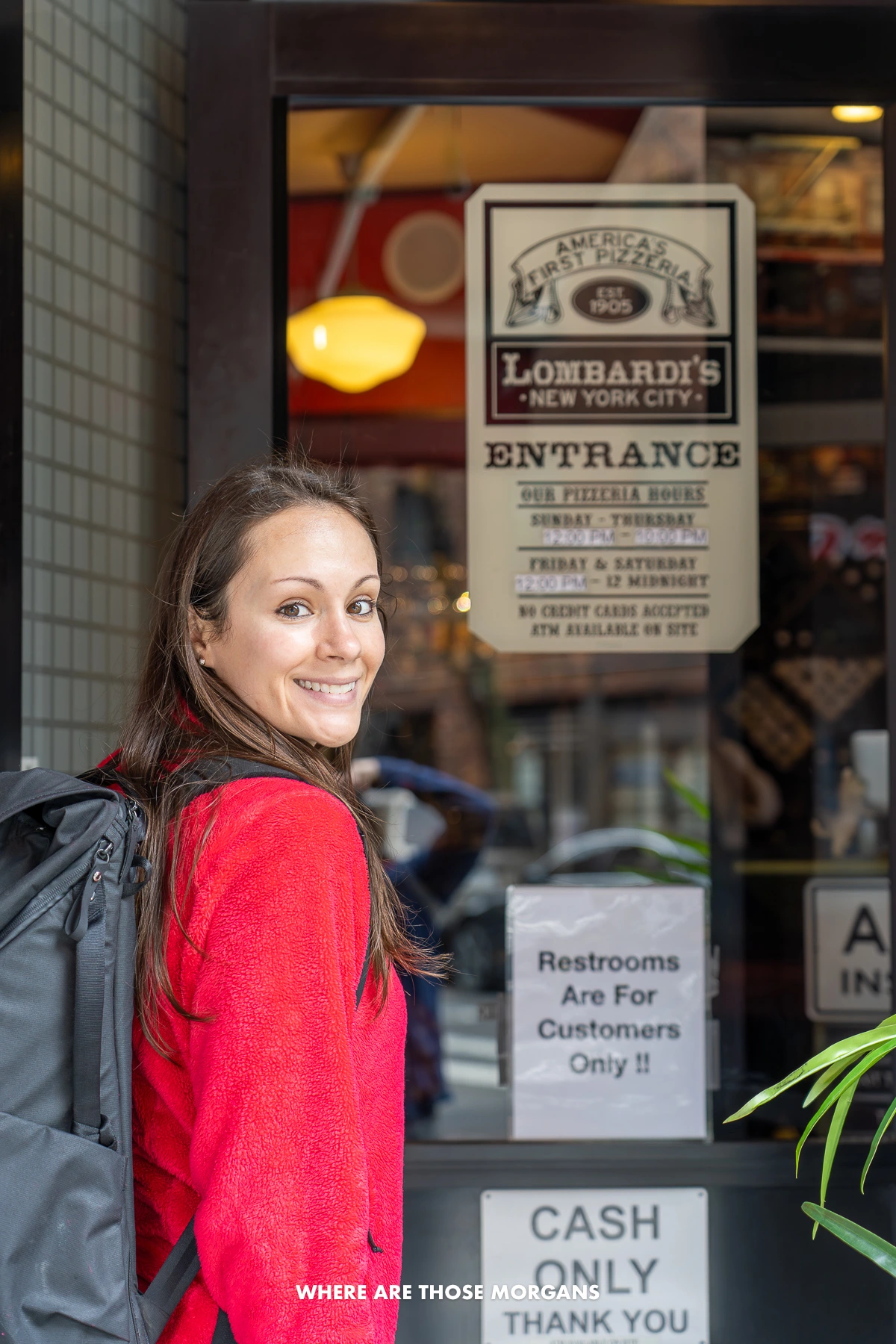 Kristen from Where Are Those Morgans entering a famous pizza joint in Nolita NYC