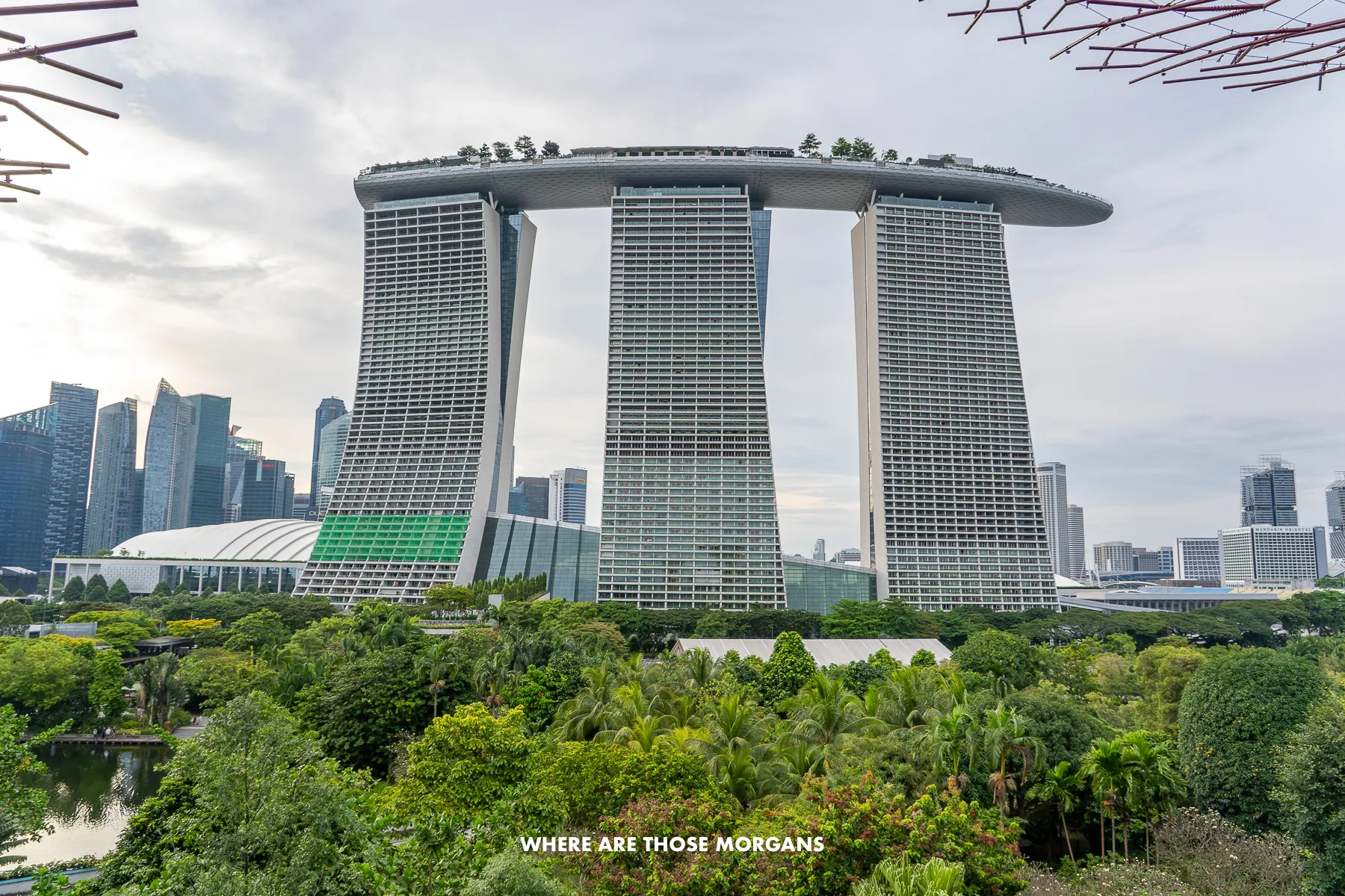 Massive hotel with three towers and a curving "surf board" summit covering the three towers