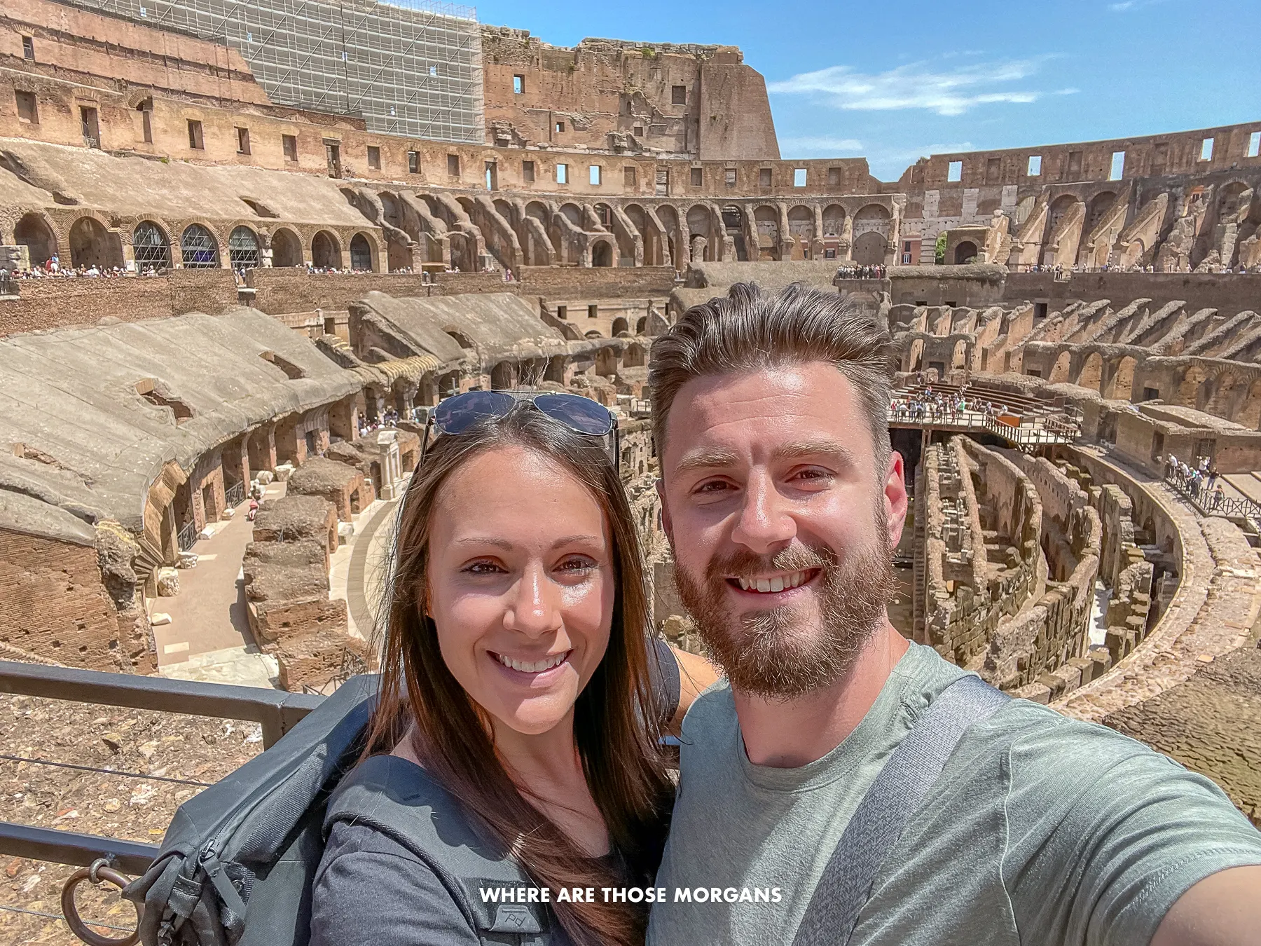 Photo of Mark and Kristen Morgan taking a selfie in the Colosseum of Rome on a sunny day
