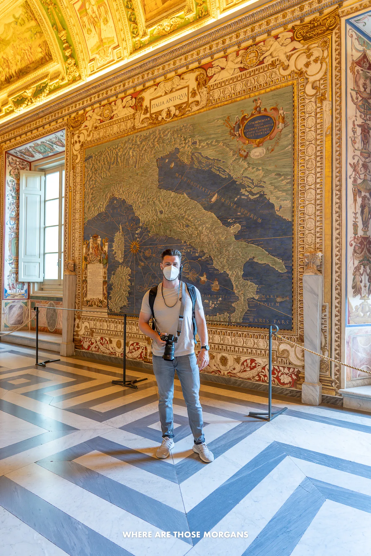 Mark from Where Are Those Morgans standing with camera and head set in the Gallery of Maps on a tour of the Vatican Museum