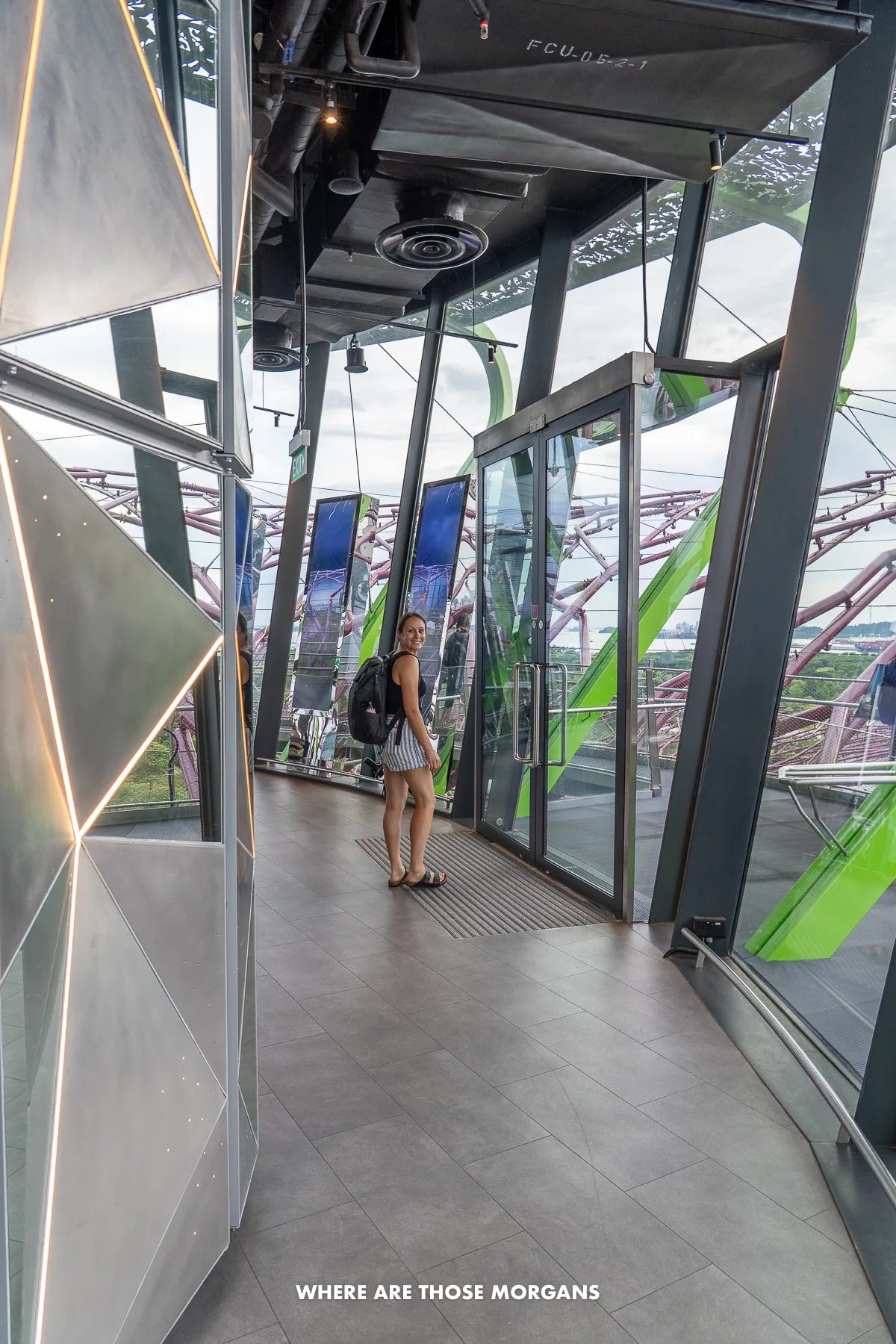 Kristen from Where Are Those Morgans walking through an indoor observation deck to a door leading outside