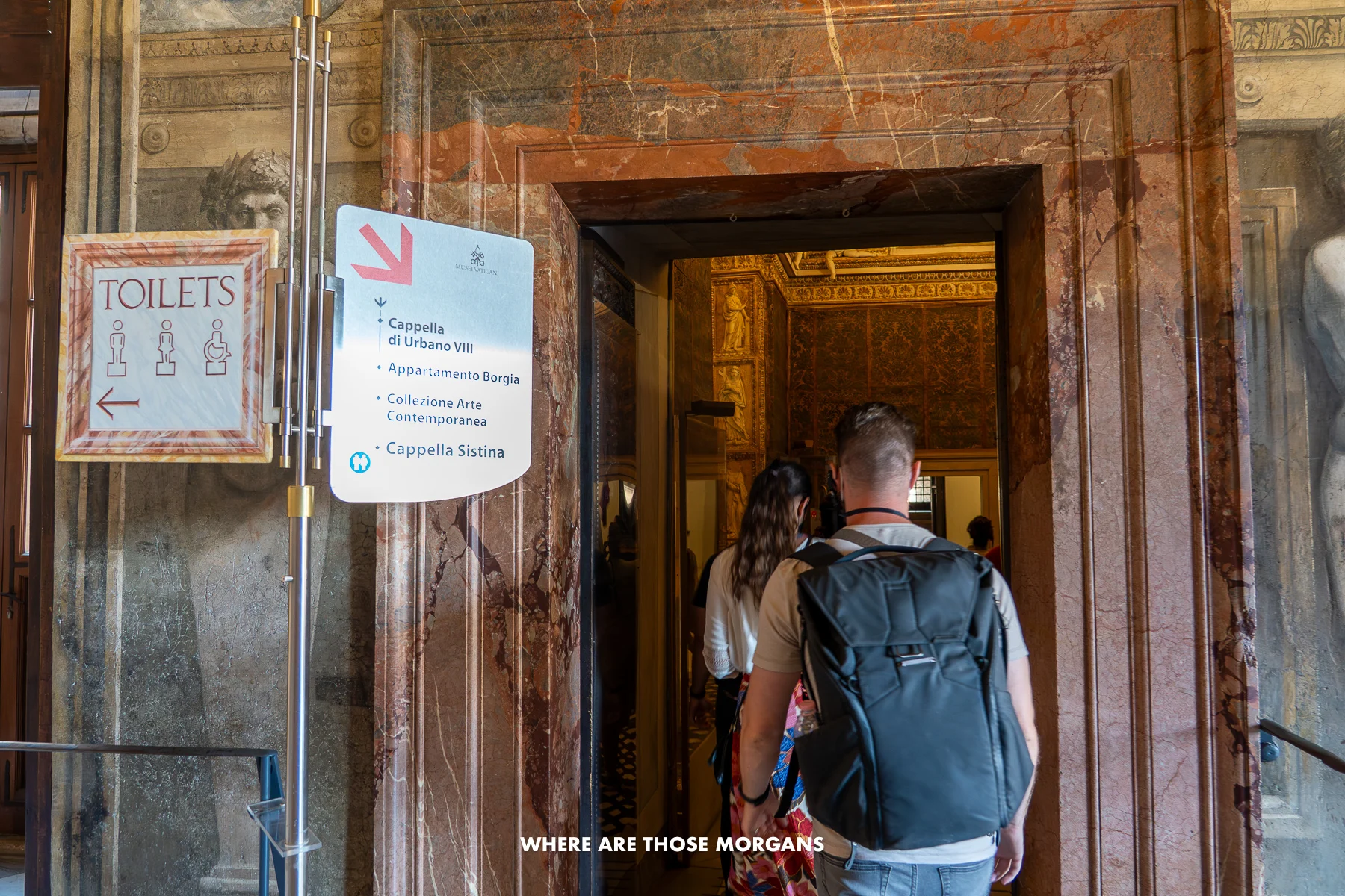 Mark from Where Are Those Morgans walking through a door following signs for the Sistine Chapel