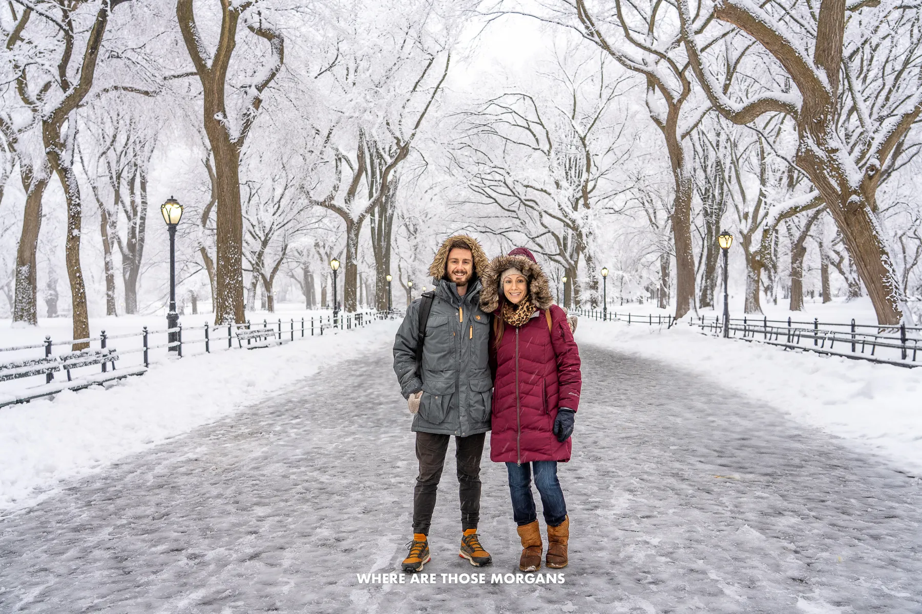 Mark and Kristen from Where Are Those Morgans wearing heavy winter coats on a snowy white out day in Central Park