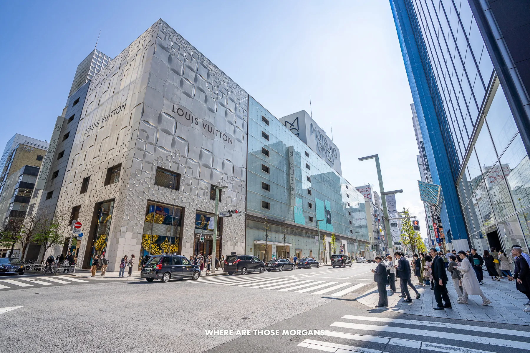 Wide open street with pedestrians, skyscrapers and high-end shopping in Japan