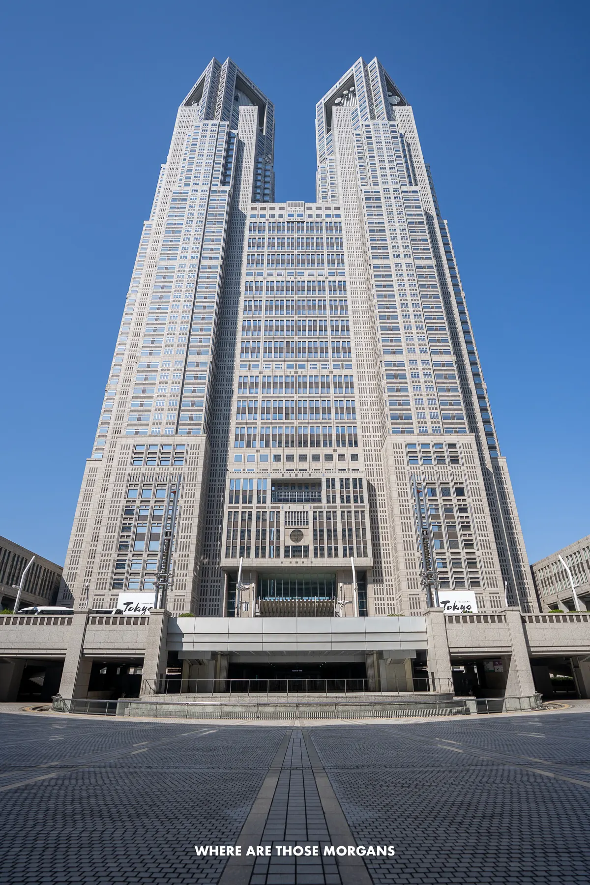 Photo of the outside of the Tokyo Metropolitan Government Building early in the morning on a clear day with no people around
