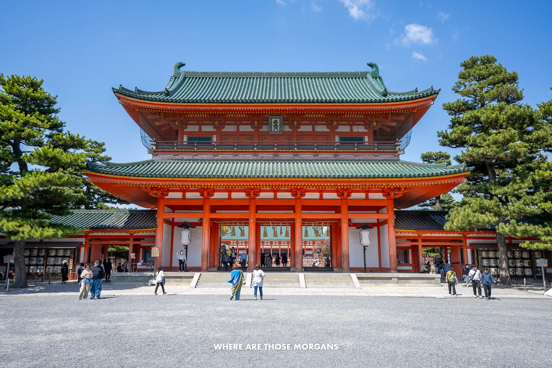Massive red colored building at the entrance to Heian Shrine in Kyoto on a clear sunny day