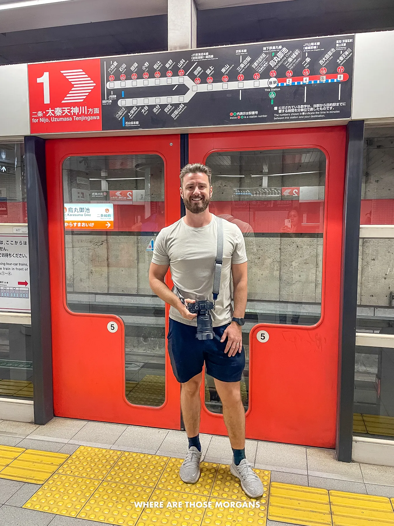 Mark from Where Are Those Morgans waiting for a train on a platform in Kyoto Japan