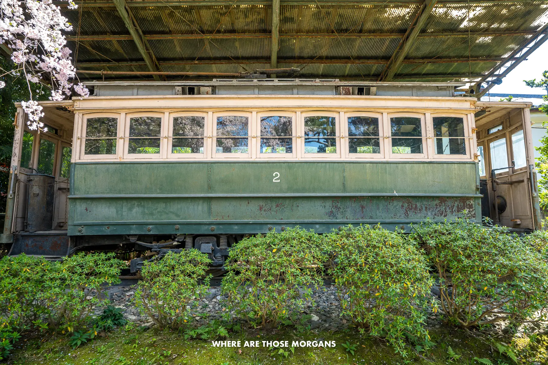 Old Kyoto city electric streetcar in the gardens at Heian Shrine