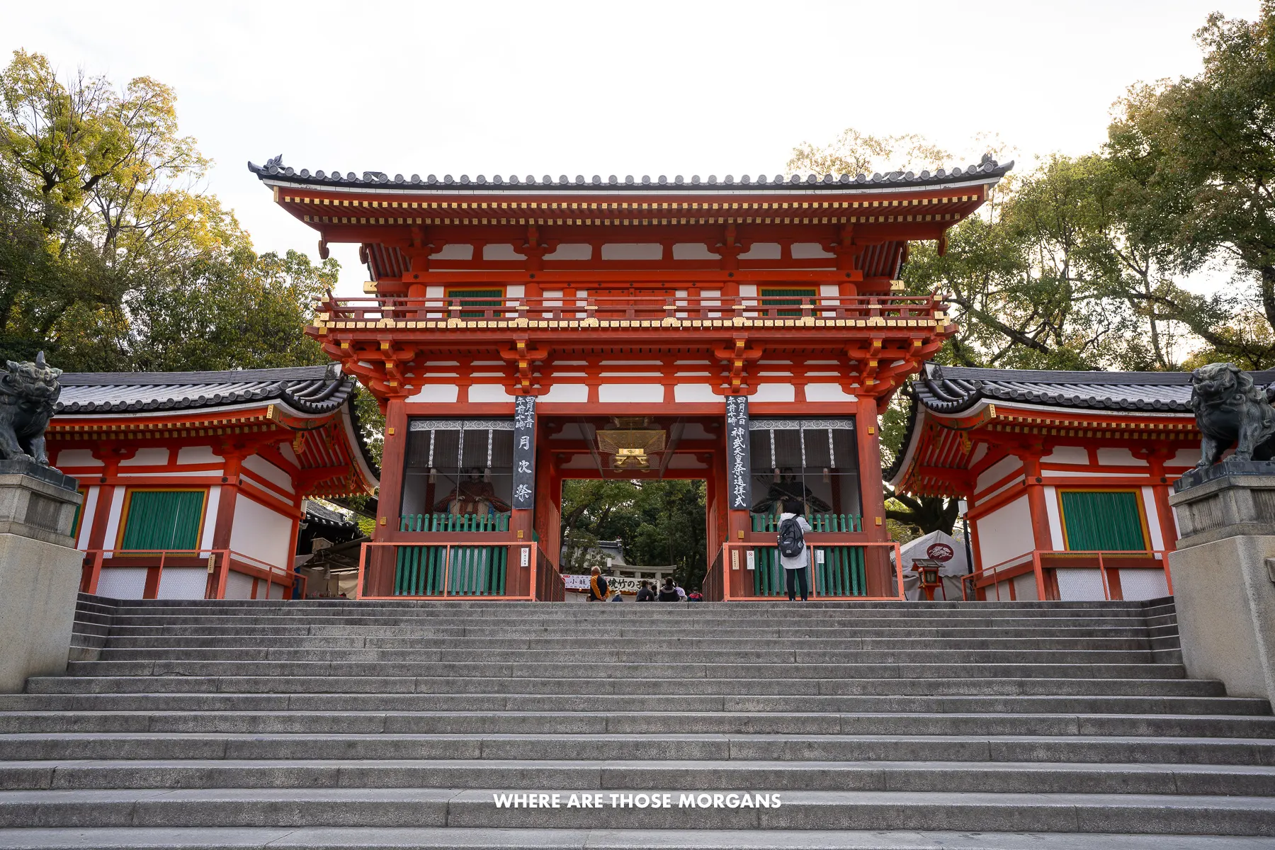 Steps leading up to a bright shrine entrance in Japan