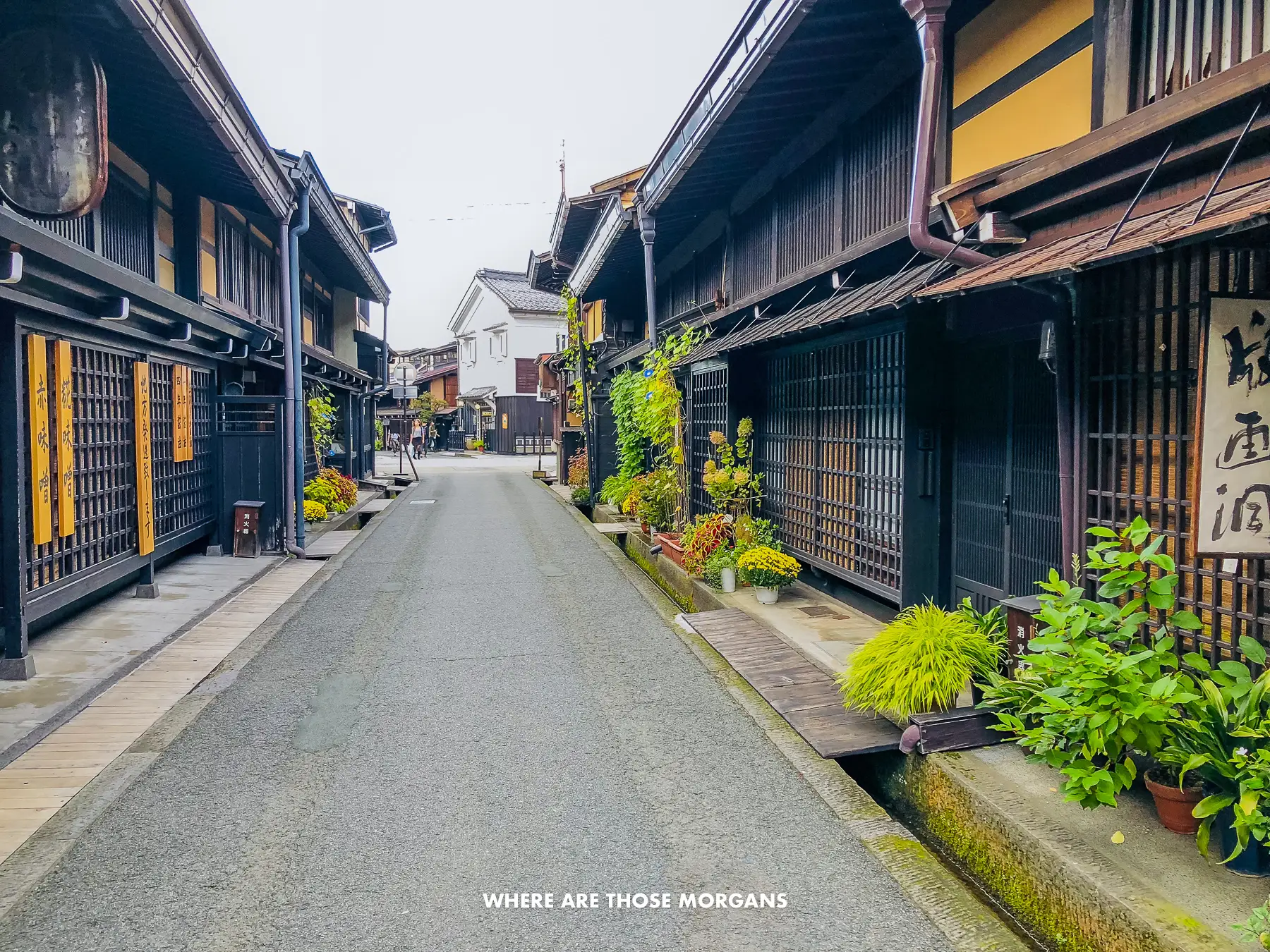 Historic wooden buildings along a narrow street in Takayama Japan