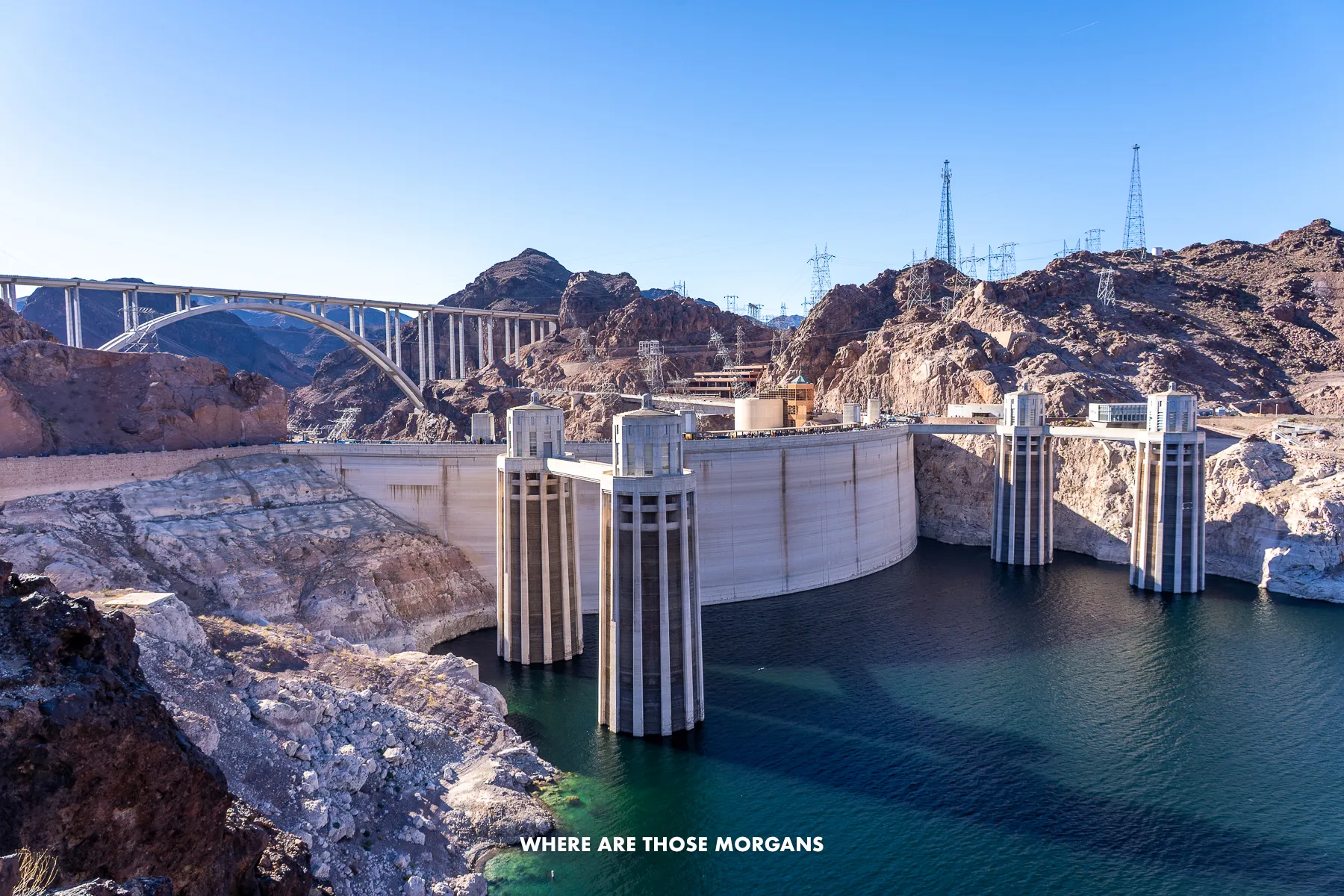 Looking at the Hoover Dam from behind on the lake side with a clear blue sky above